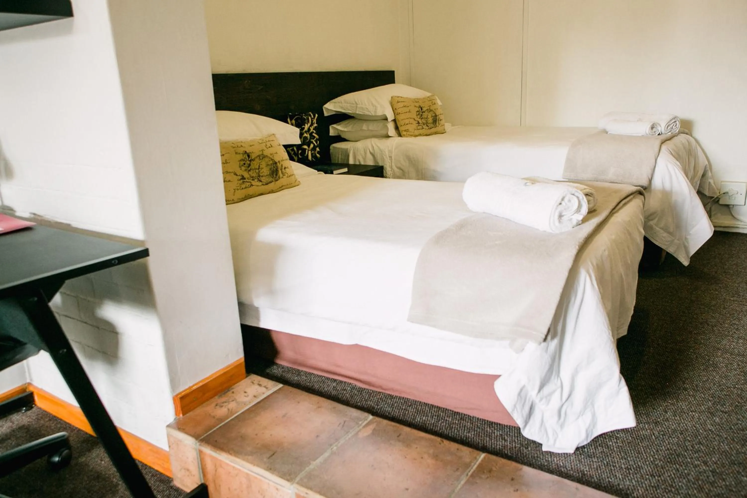 Bed in Pennylane Guest House