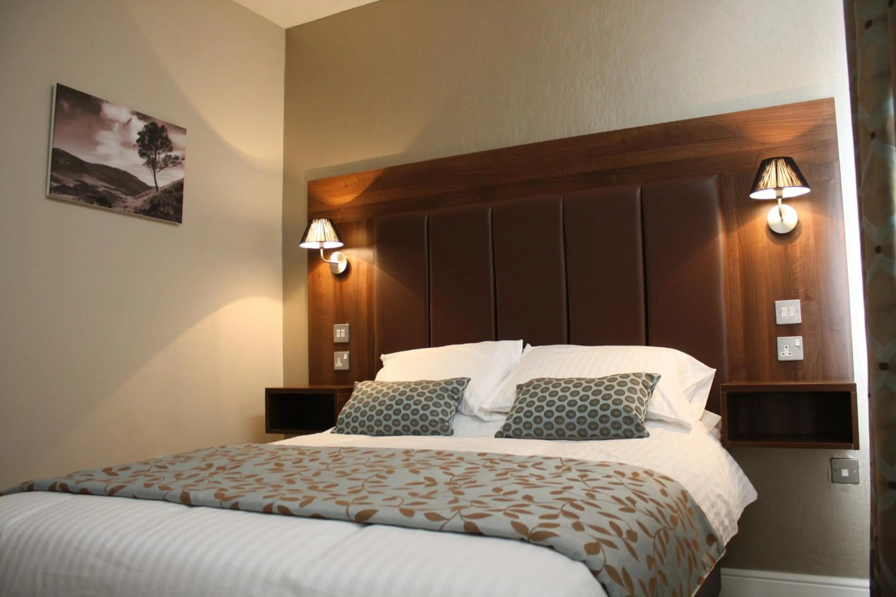 Bed in Twin Oaks Hotel