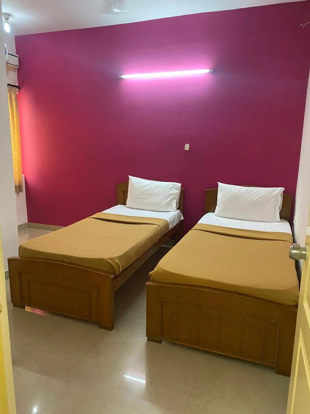 Bed in ThulasiRams Service Apartments