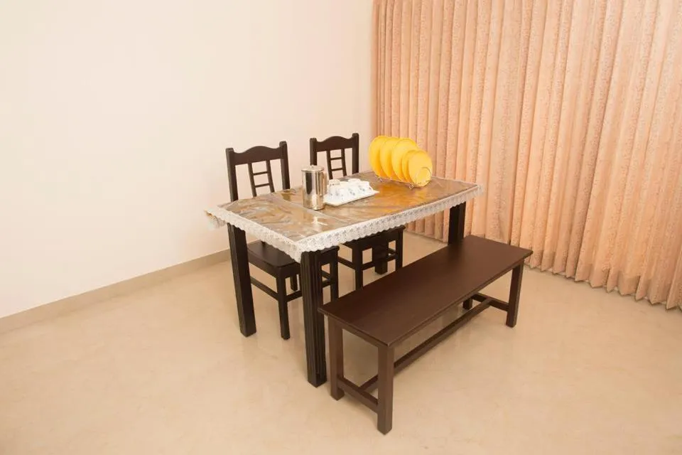 Dining area in ThulasiRams Service Apartments