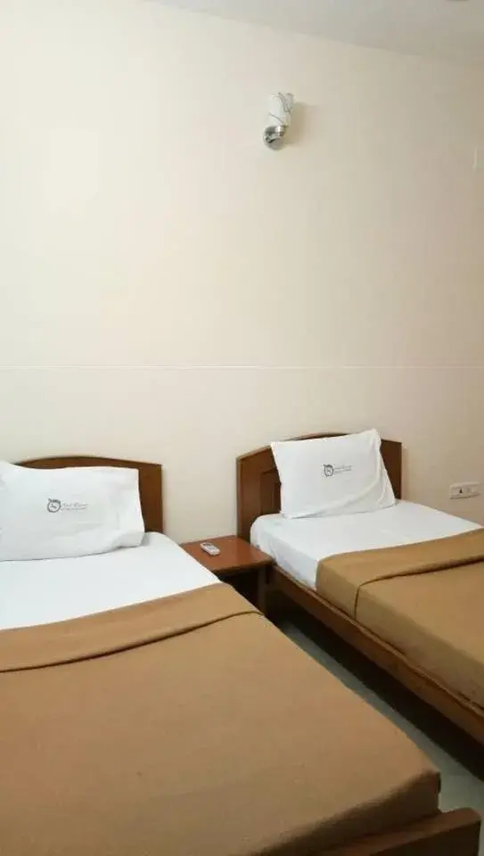 Bed in ThulasiRams Service Apartments Bed in ThulasiRams Service Apartments