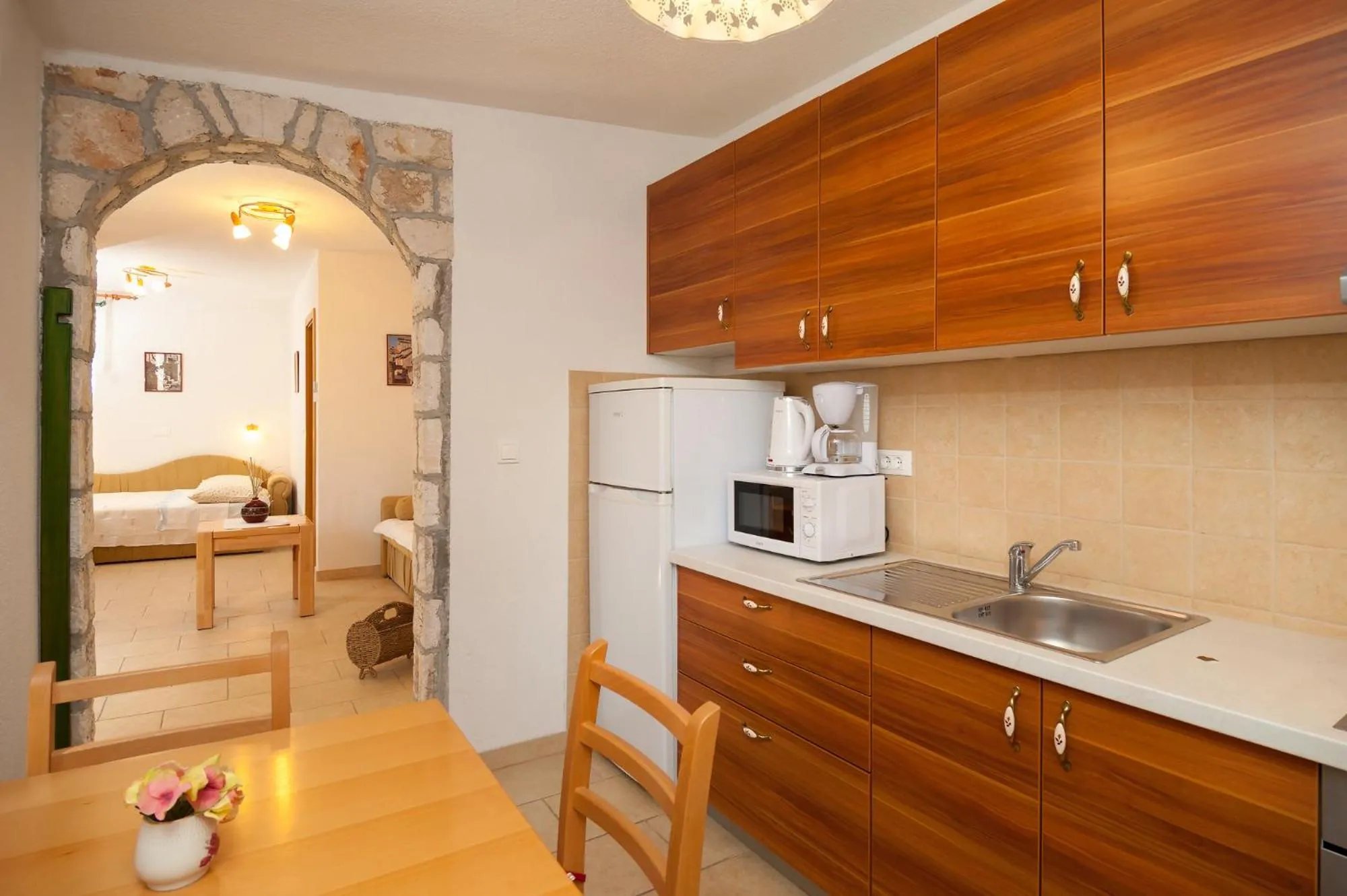 Kitchen or kitchenette in Apartments Mande and Kate