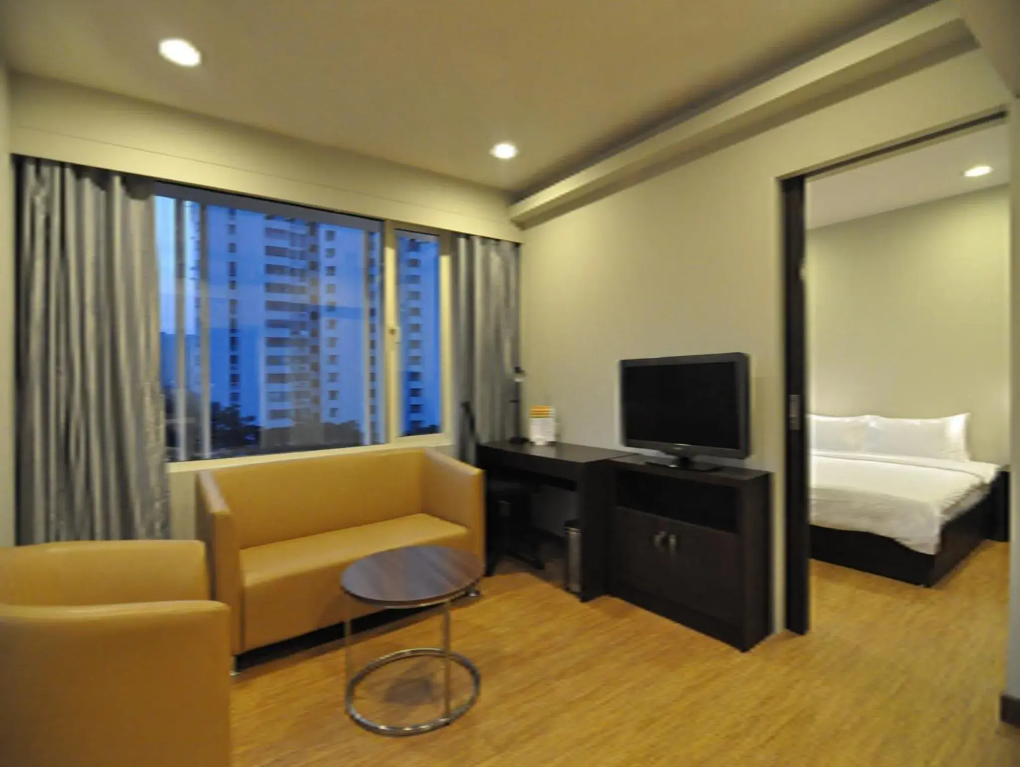 Living room, Bed in Keys Select by Lemon Tree Hotels, Kochi Living room, Bed in Keys Select by Lemon Tree Hotels, Kochi