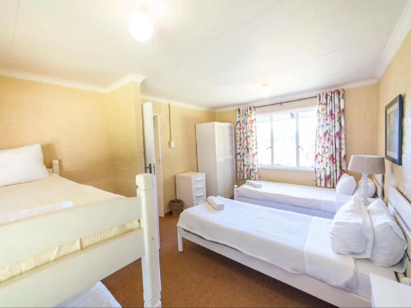 Bed in Lake Naverone Holiday Cottages