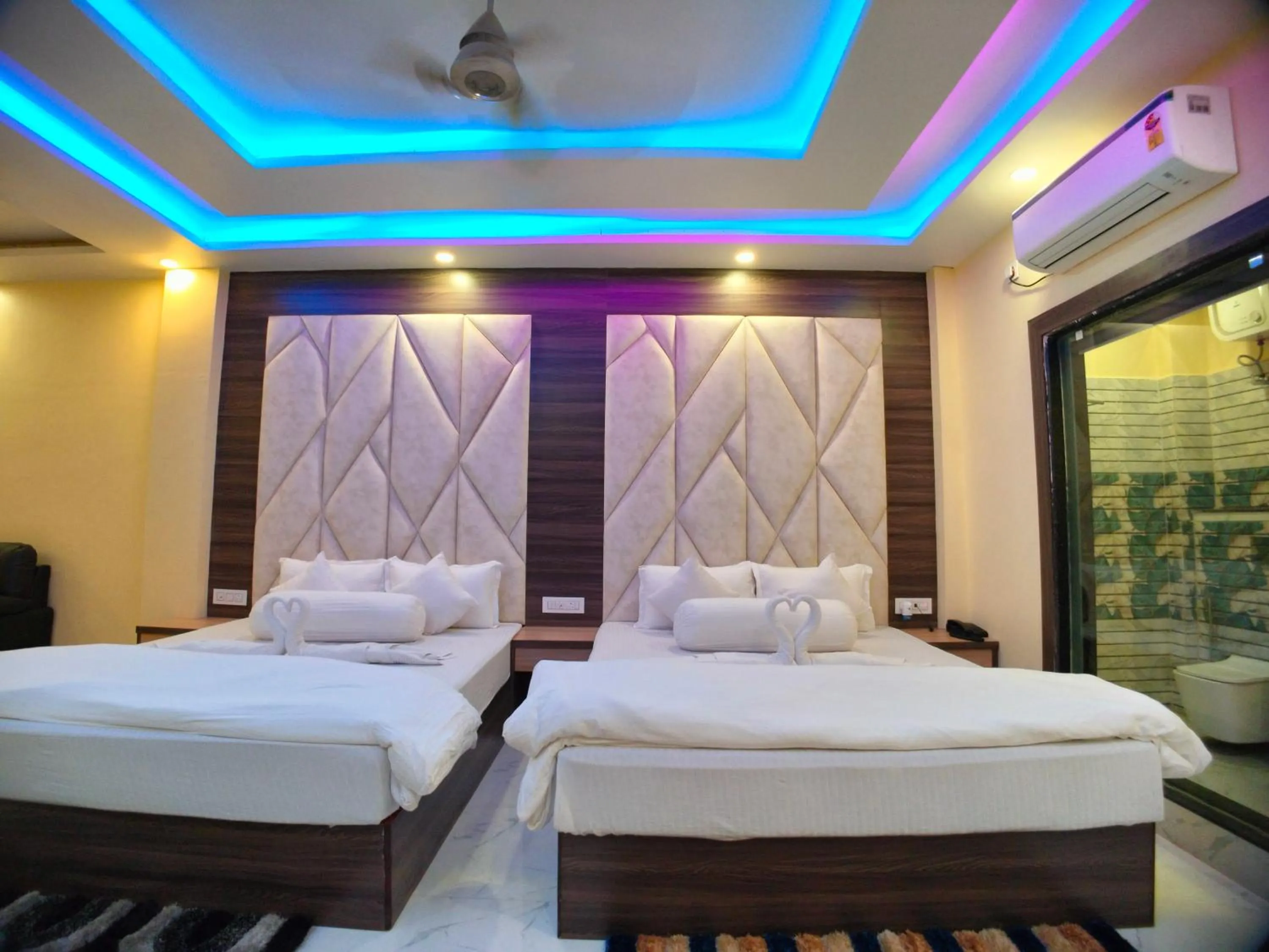 Bed in The Triton Beach Resort