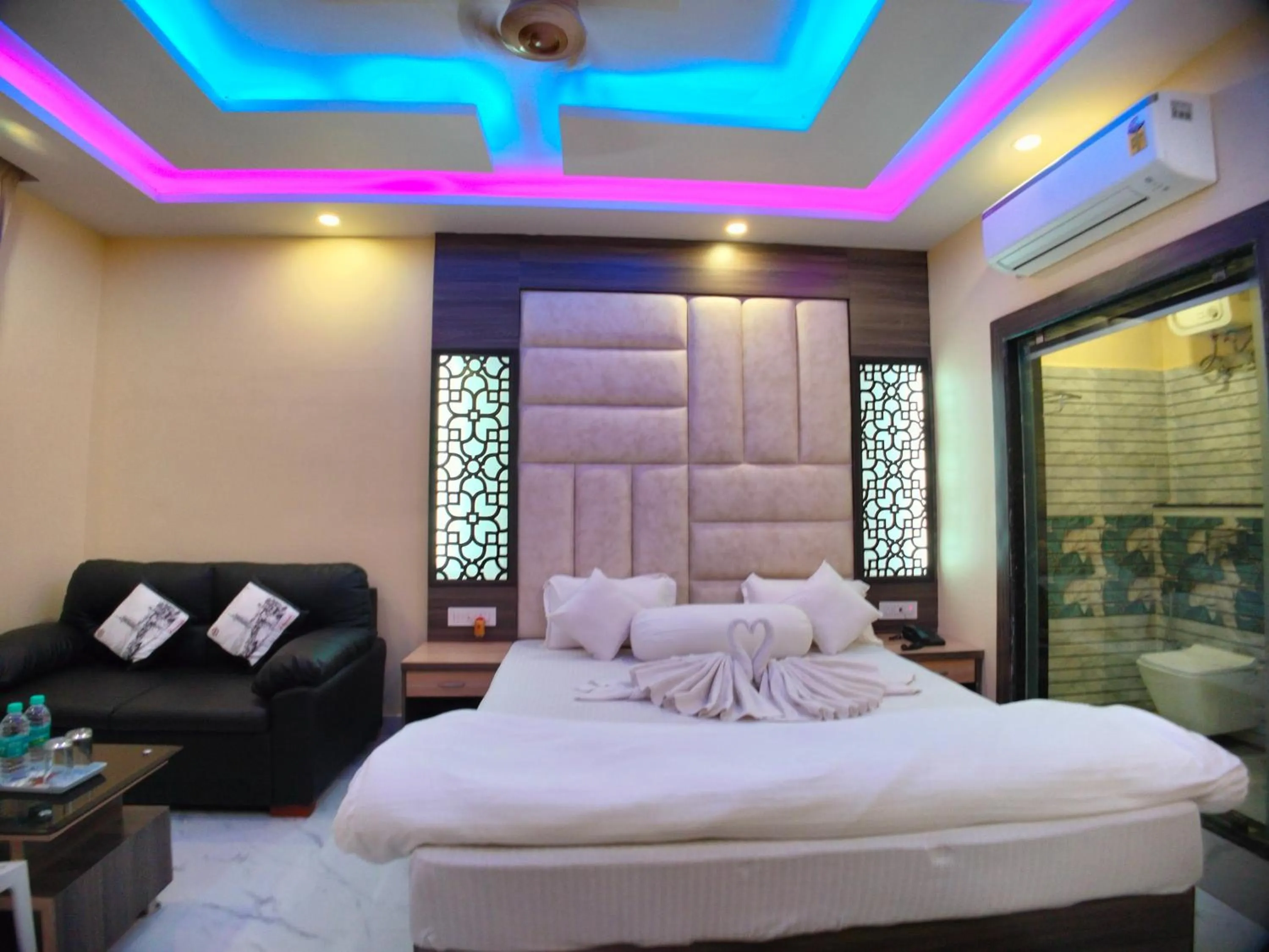 Bed in The Triton Beach Resort