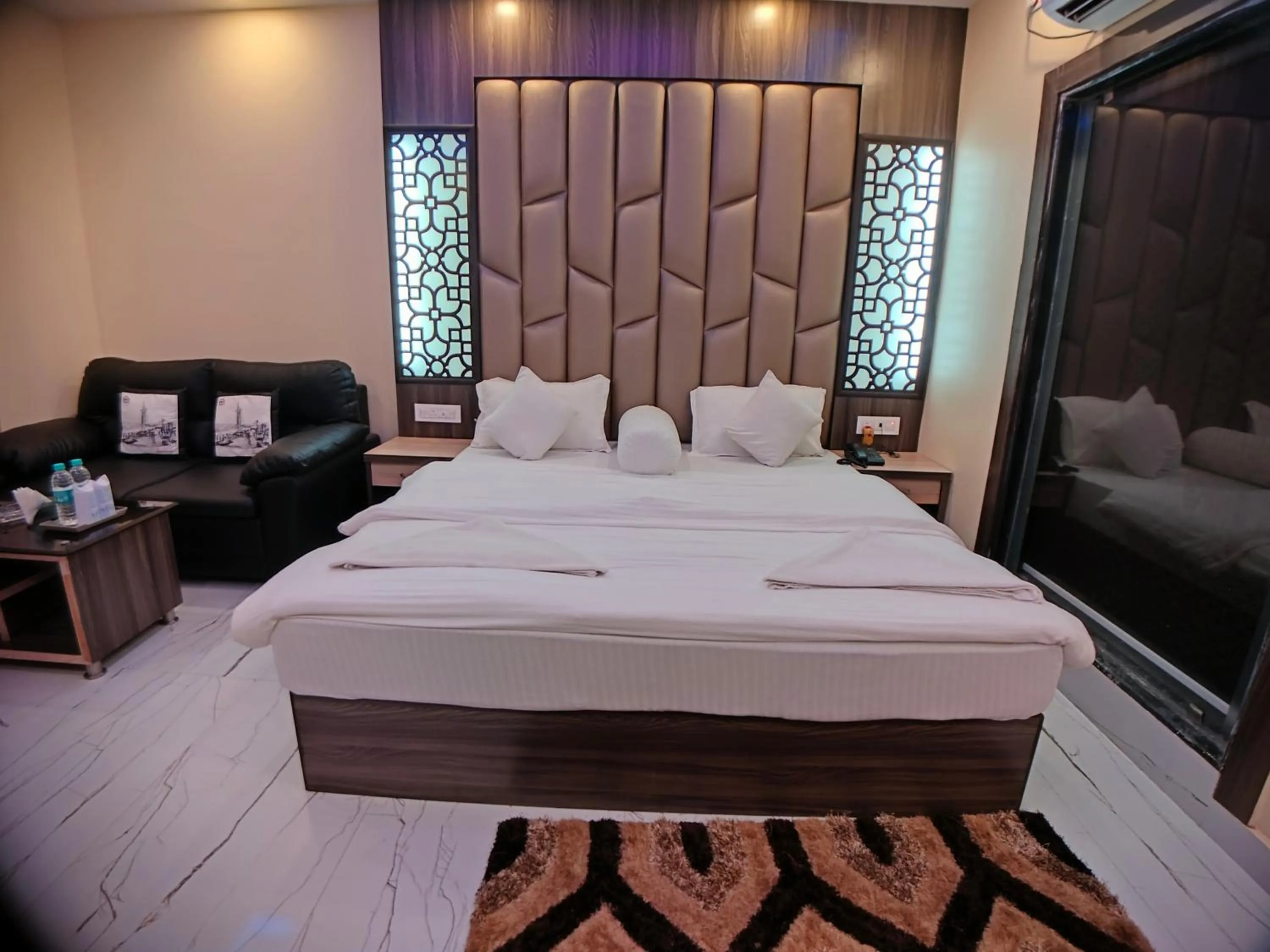 Bed in The Triton Beach Resort