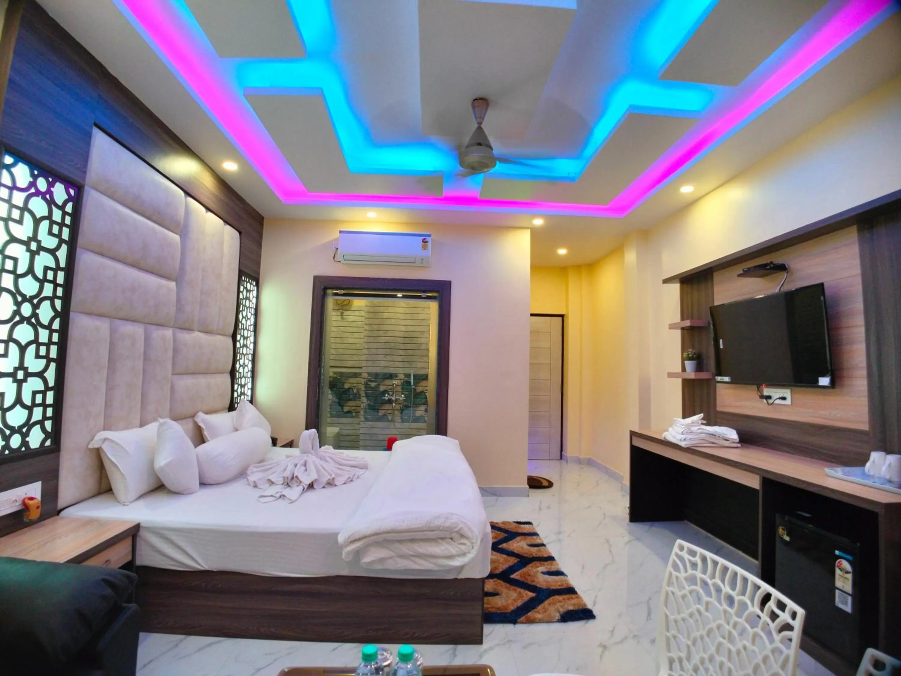 Bed in The Triton Beach Resort