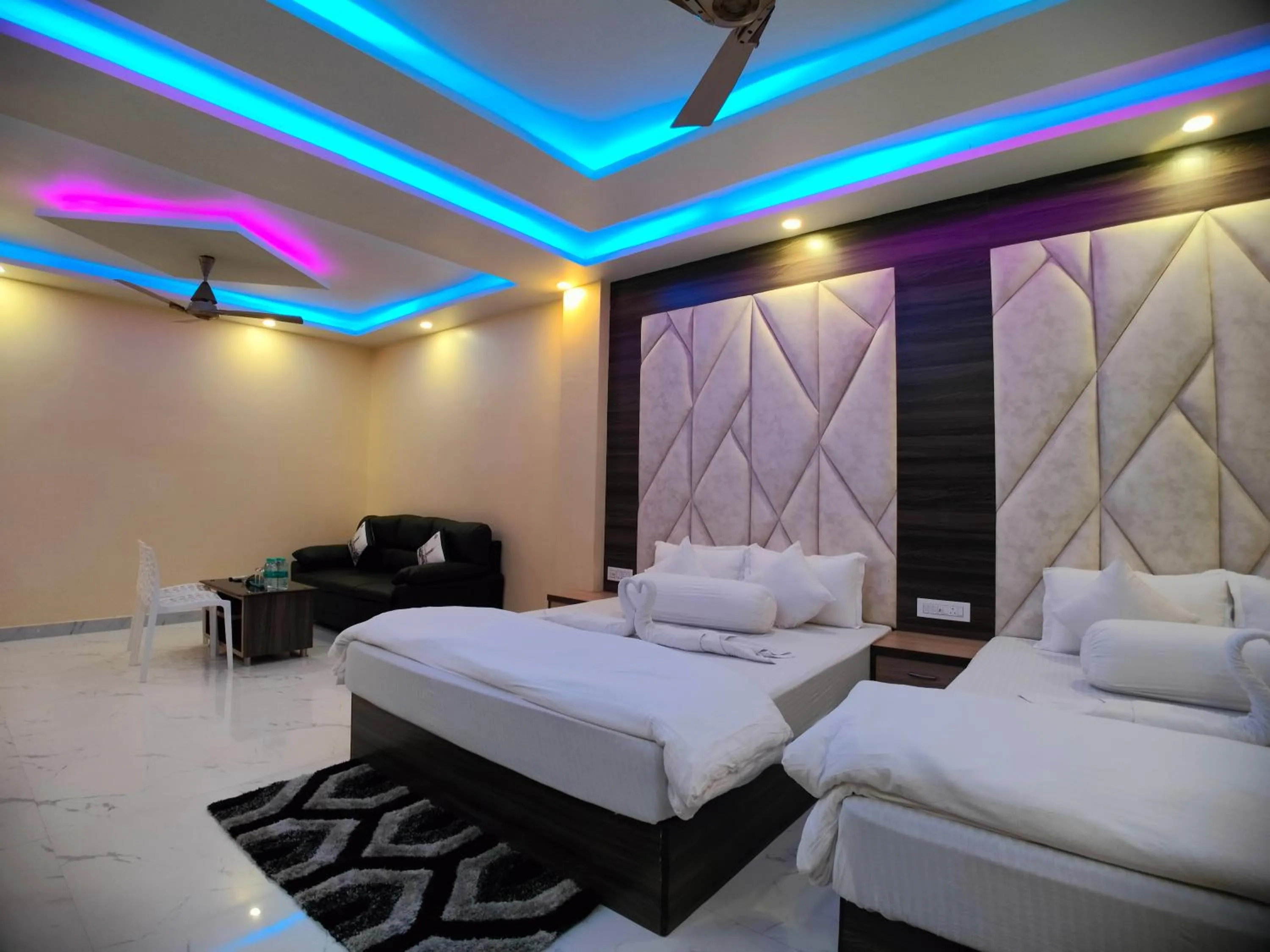 Bed in The Triton Beach Resort