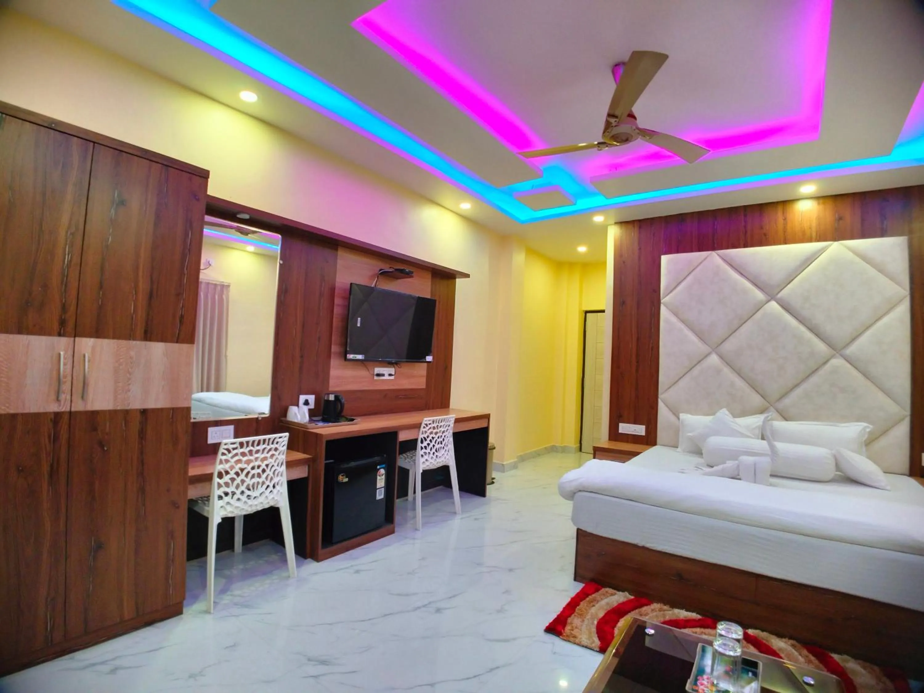 Bed in The Triton Beach Resort