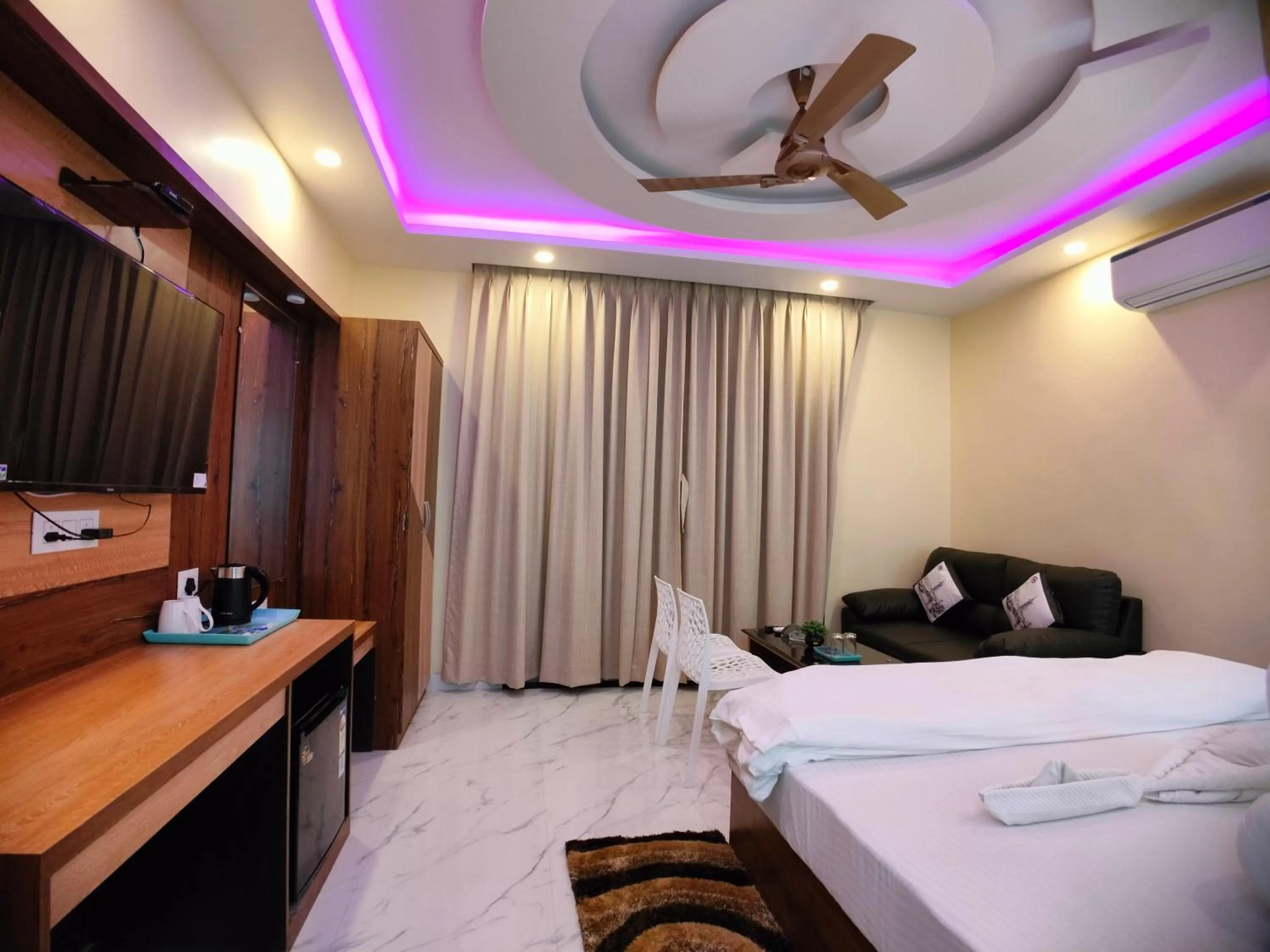 Bed in The Triton Beach Resort