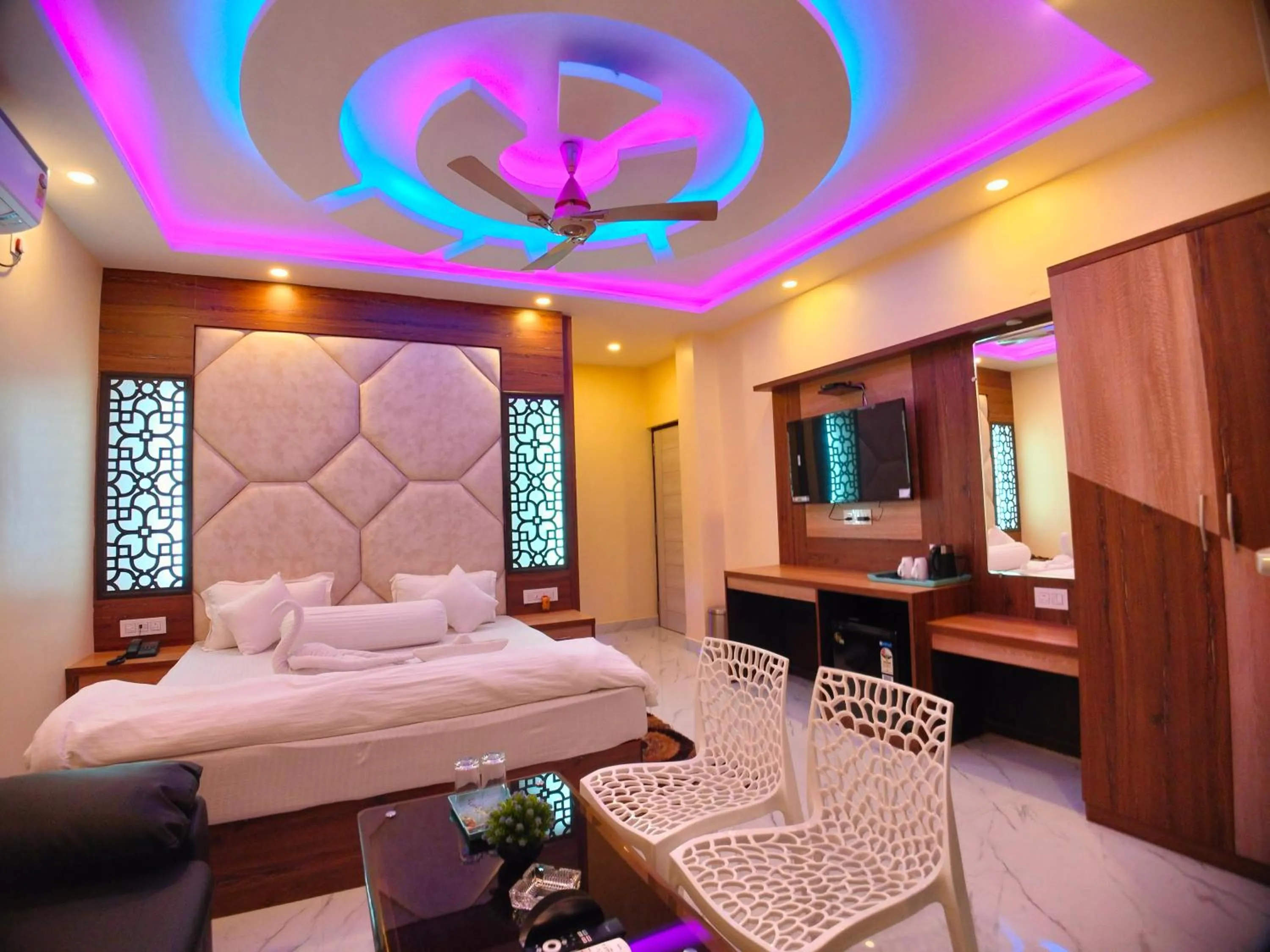 Bed in The Triton Beach Resort