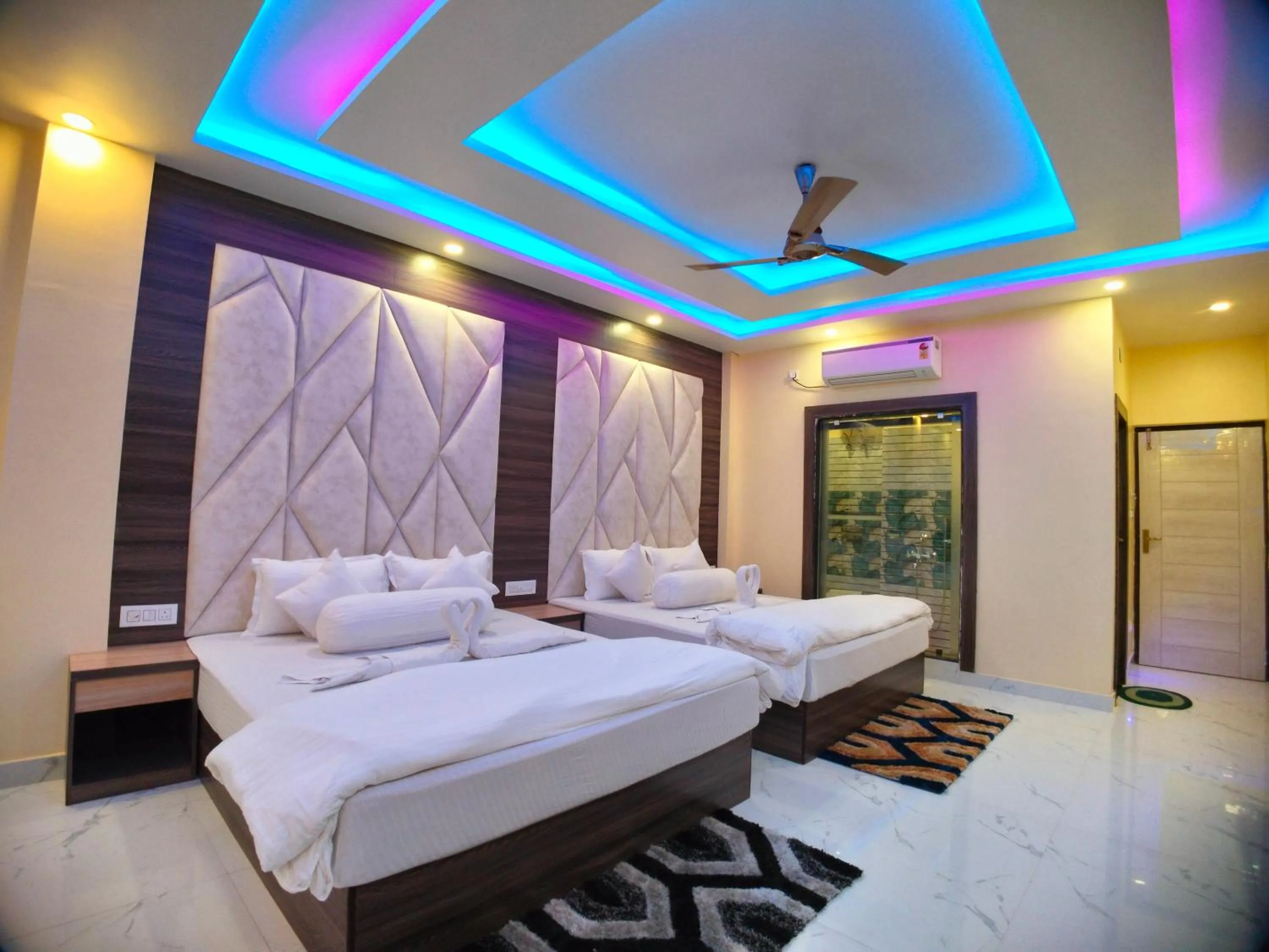 Bed in The Triton Beach Resort