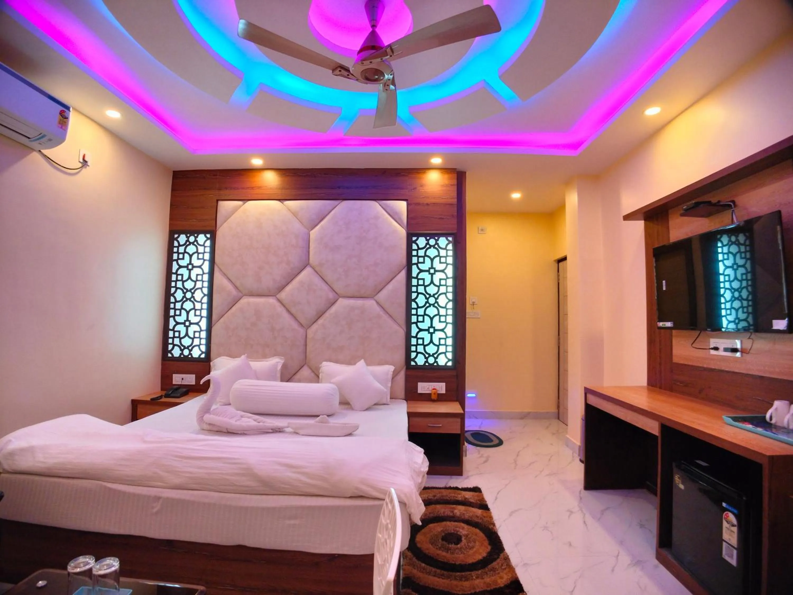 Bed in The Triton Beach Resort