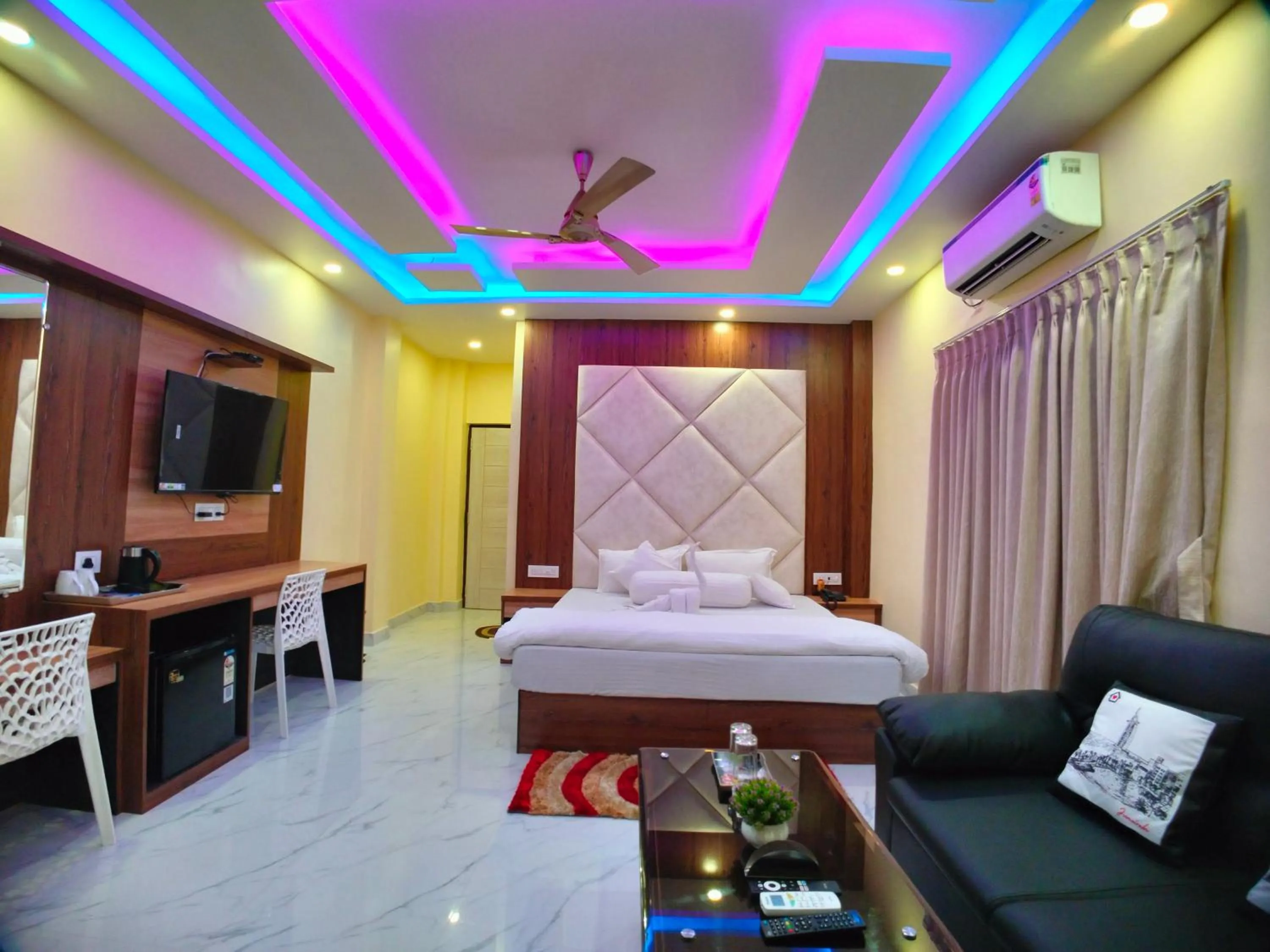 Bed in The Triton Beach Resort