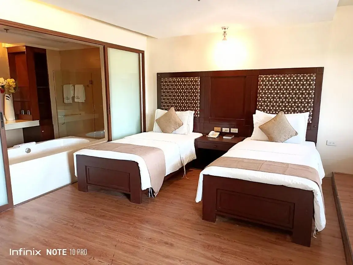 Bedroom, Bed in Coron Gateway Hotel & Suites Bedroom, Bed in Coron Gateway Hotel & Suites