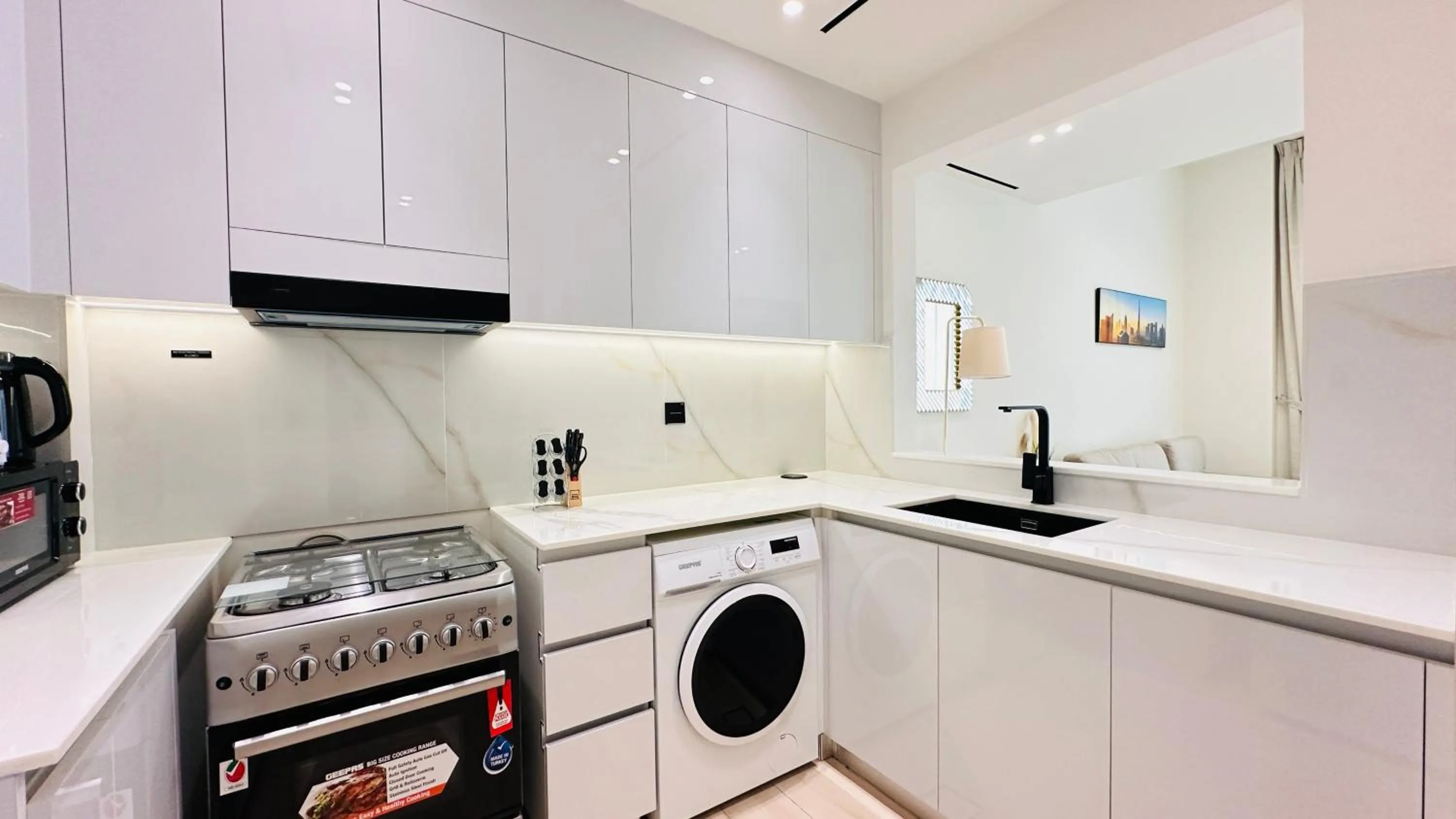 Kitchen or kitchenette in OYO 1291 Home Fully Furnished 1bed Apt @JVC