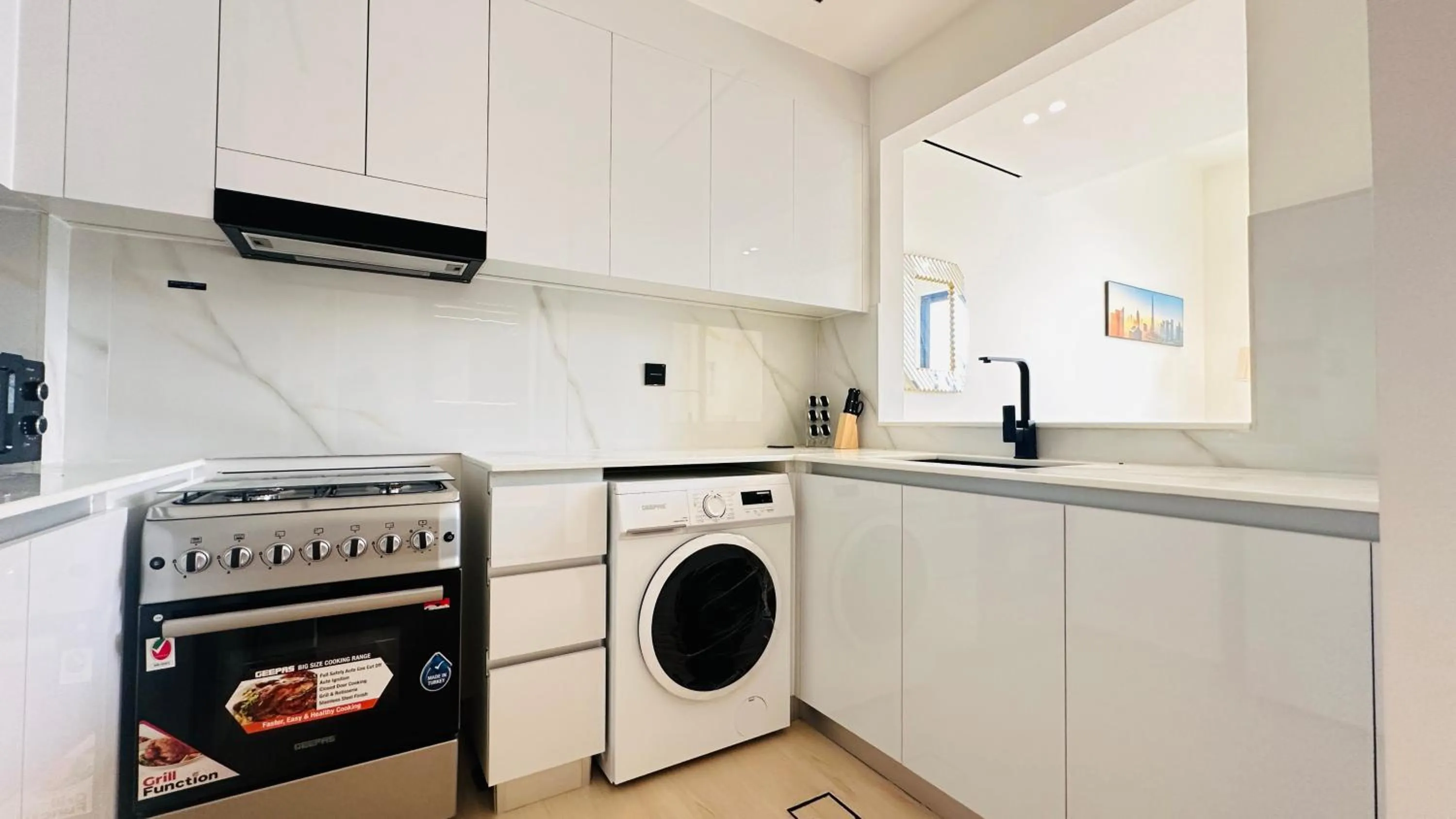 Kitchen or kitchenette in OYO 1292 Home Fully Furnished 1bed Apt @JVC