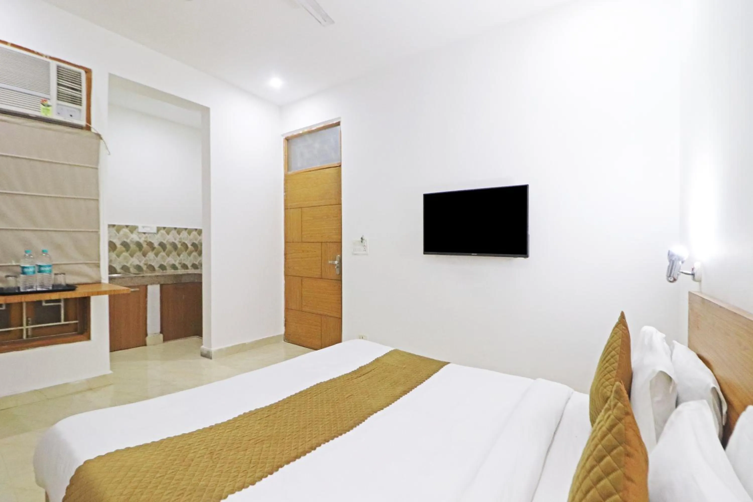 Bed in Mauryan Elite Hotel Chhatarpur Metro Station