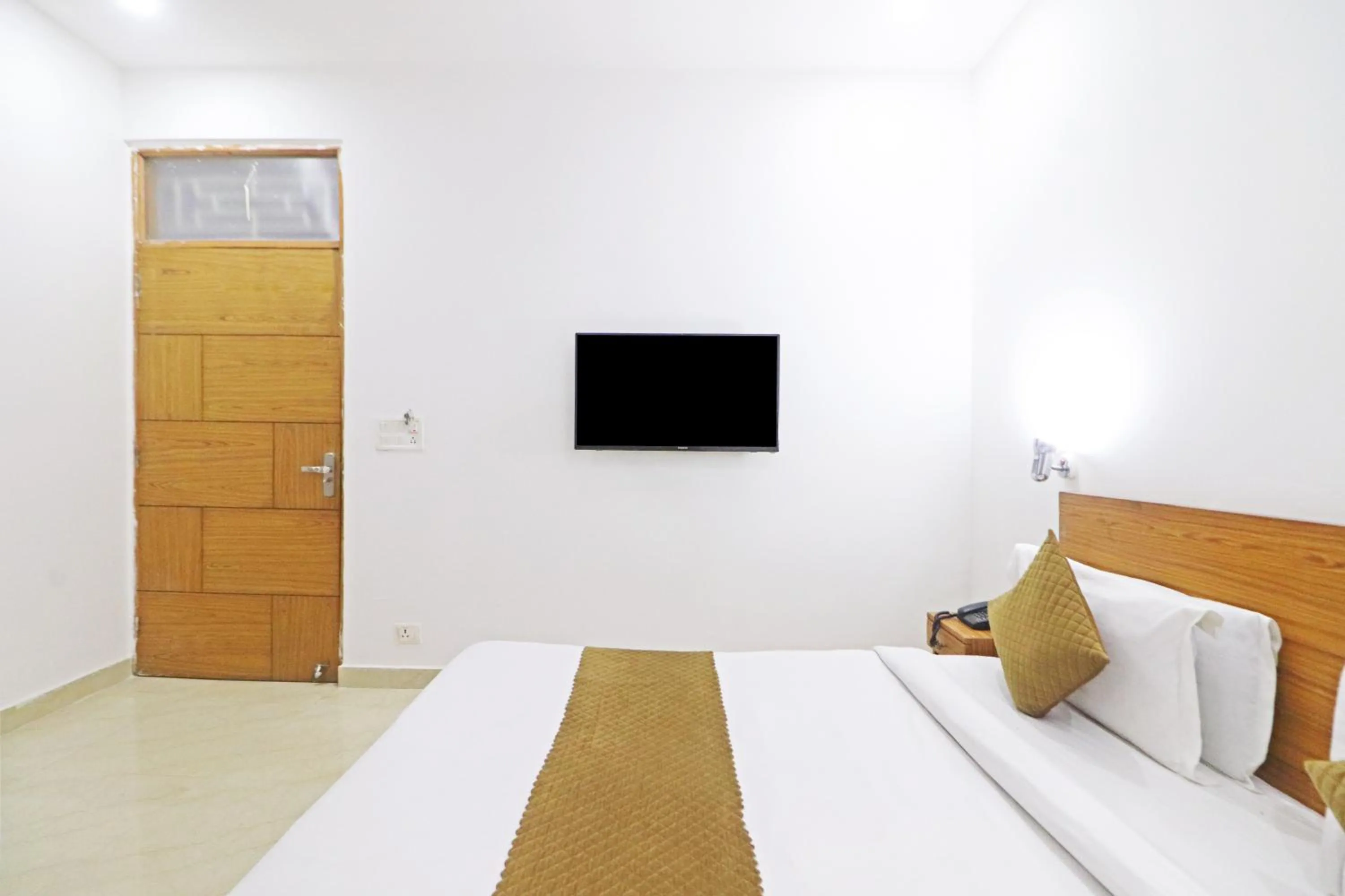 Bed in Mauryan Elite Hotel Chhatarpur Metro Station