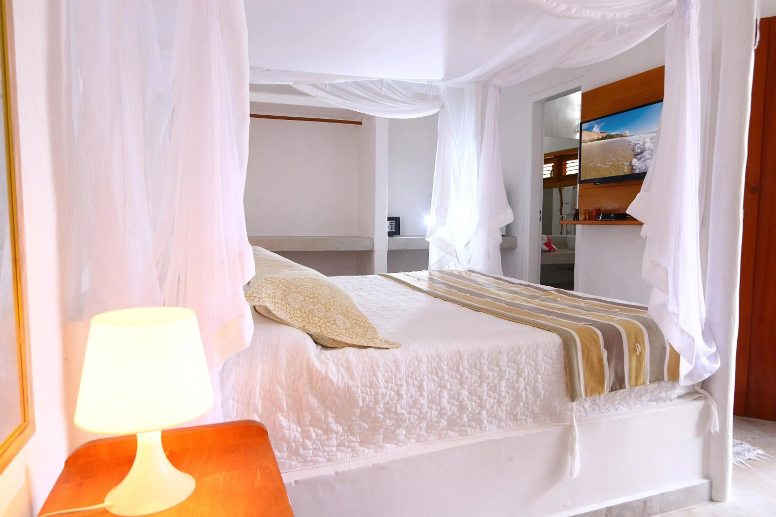 Bed in Pousada Rigatoni