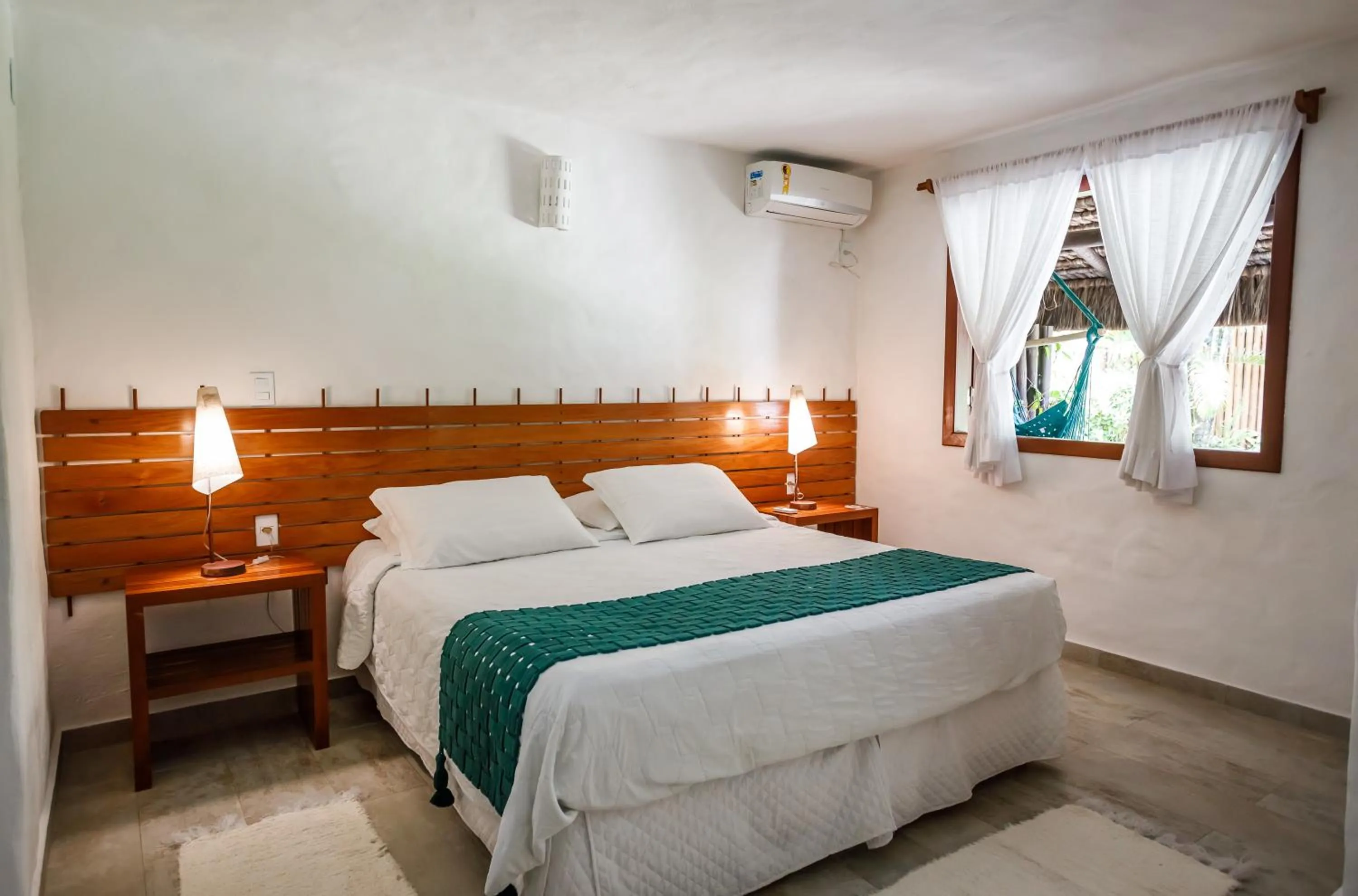 Bed in Pousada Rigatoni