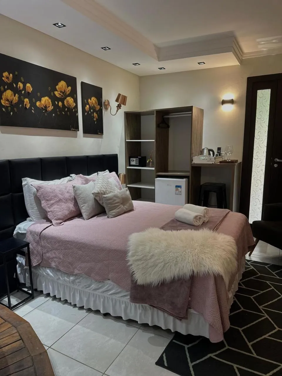 Bed in Bombinhas Guest House