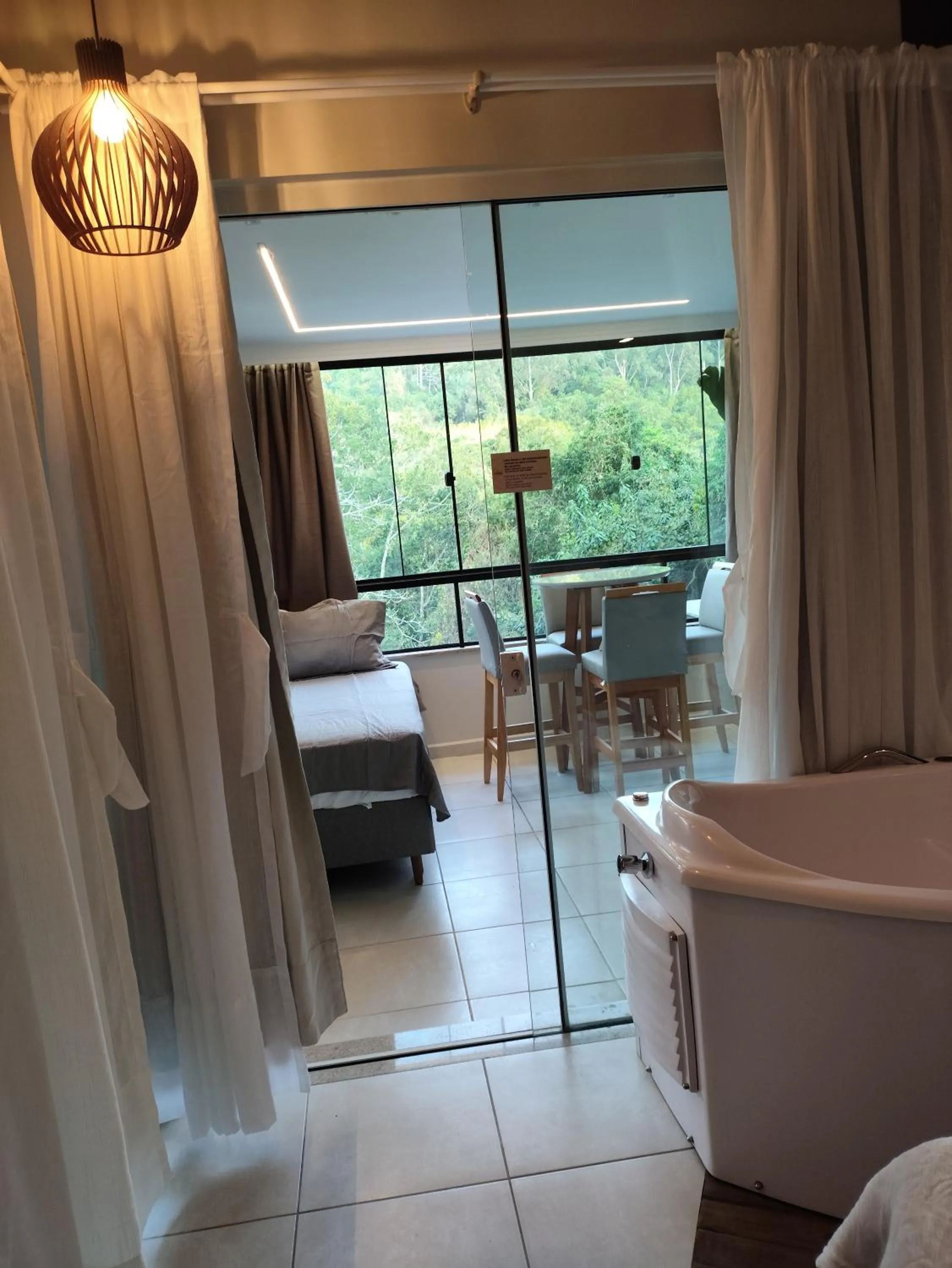 Bed in Bombinhas Guest House