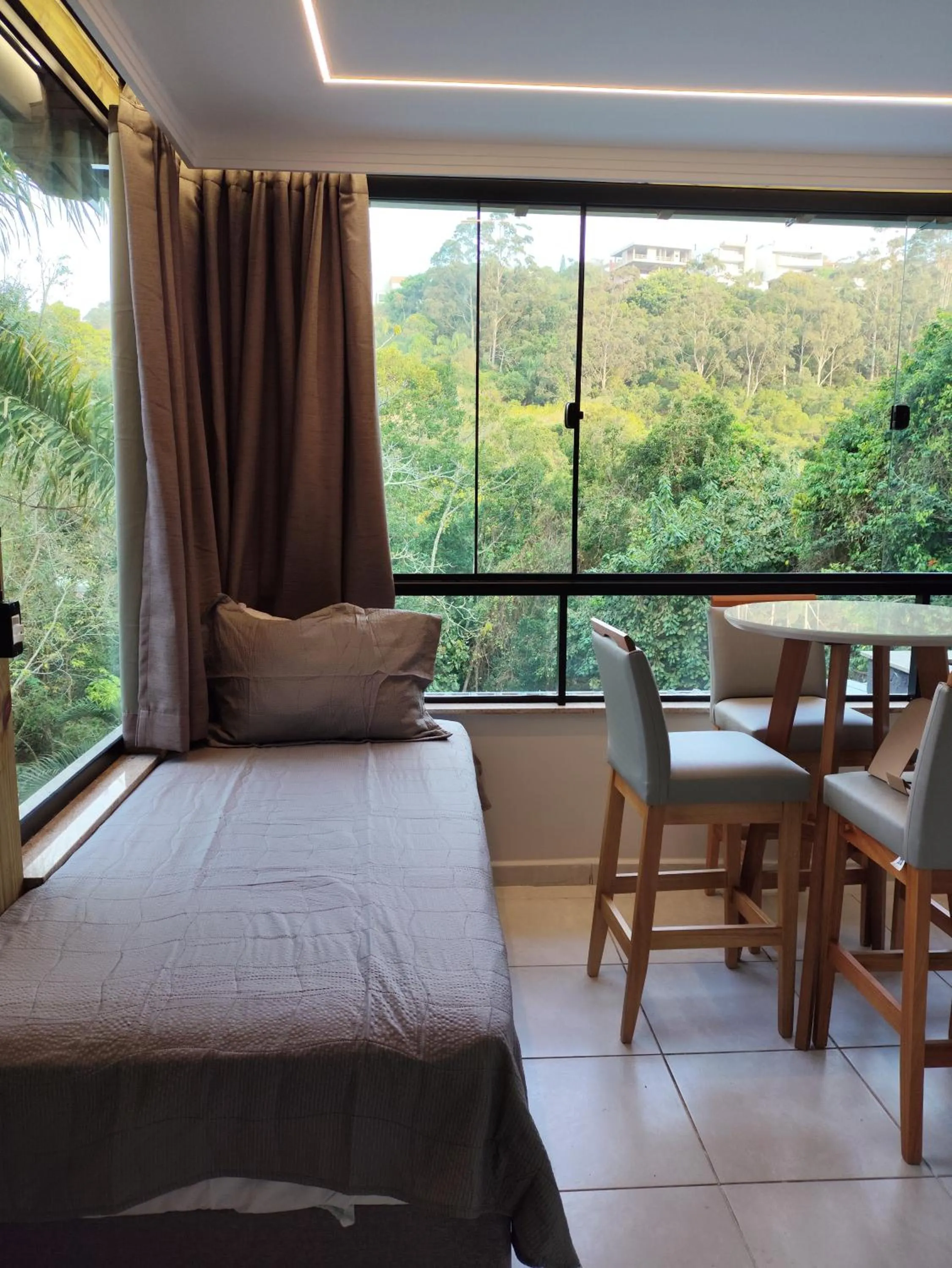 Bed in Bombinhas Guest House