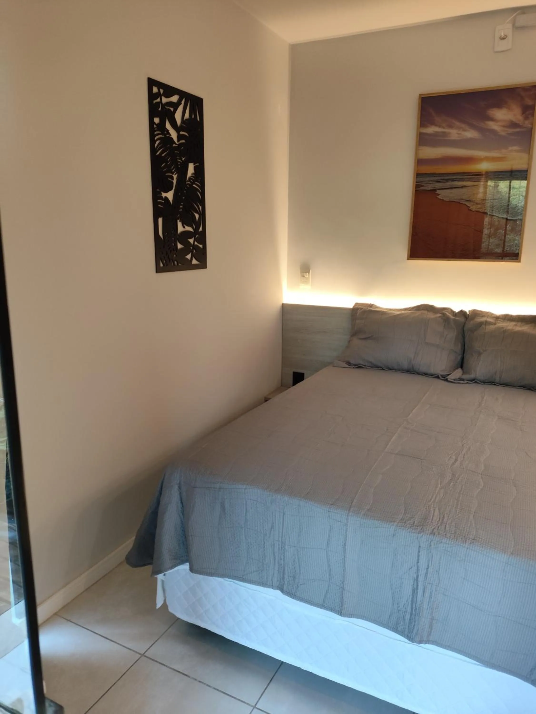 Bed in Bombinhas Guest House