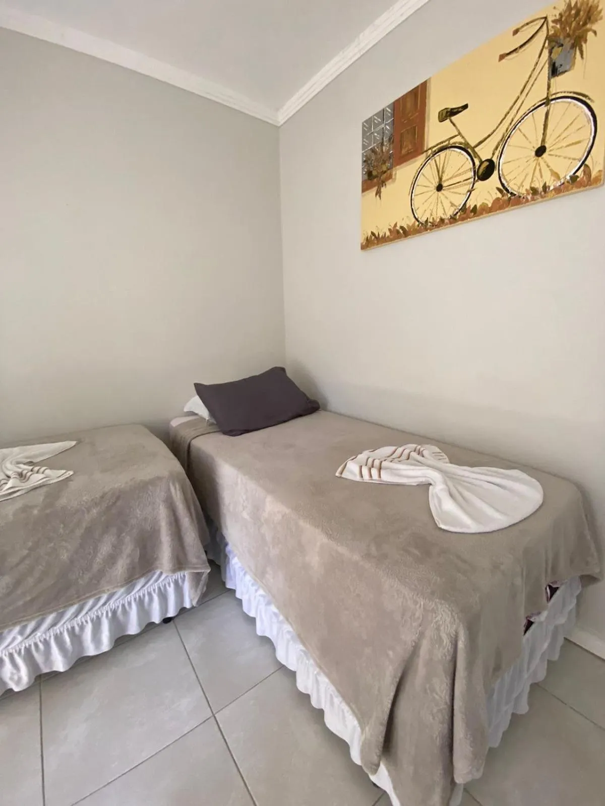 Bed in Bombinhas Guest House