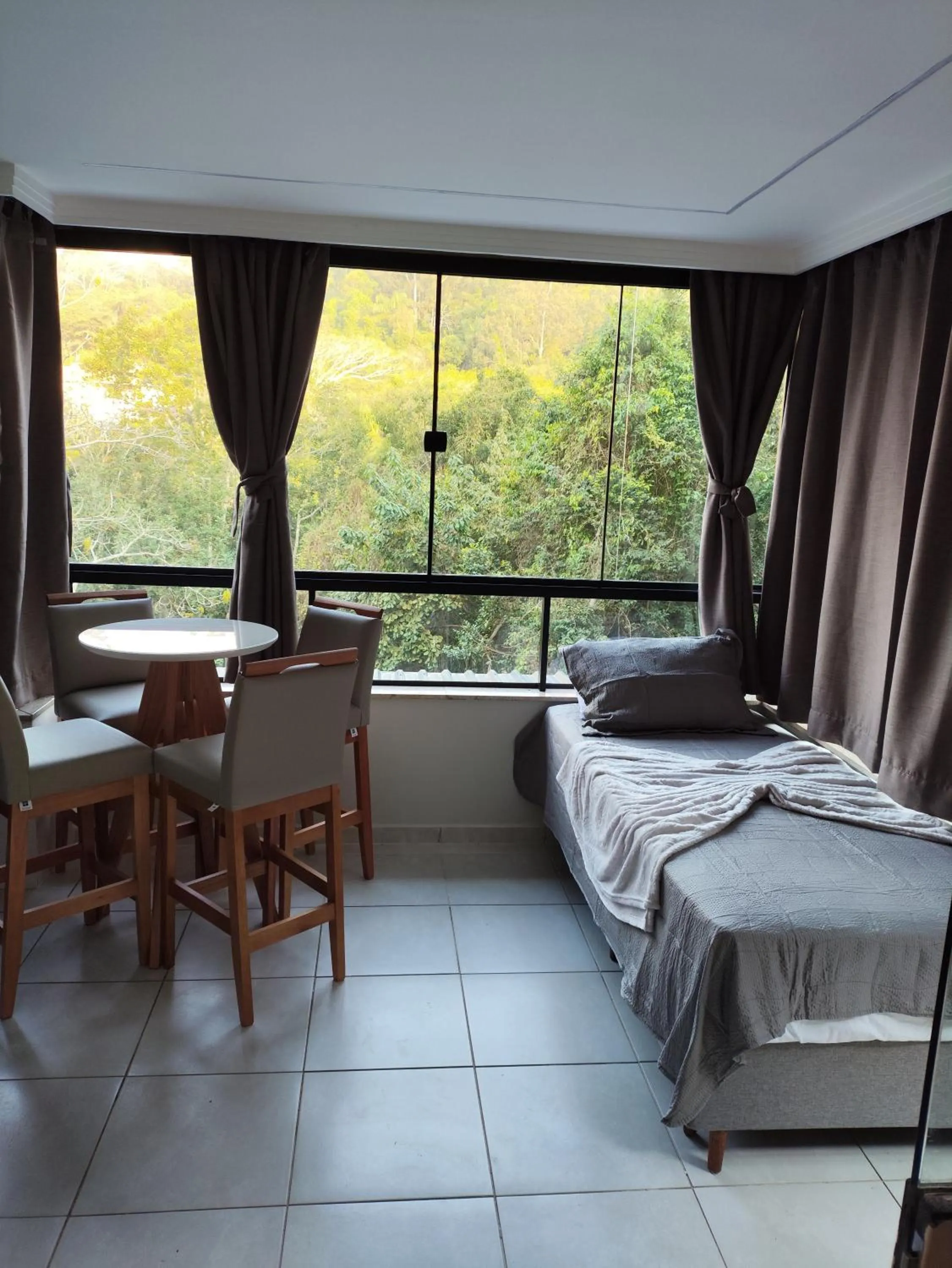 Bed in Bombinhas Guest House