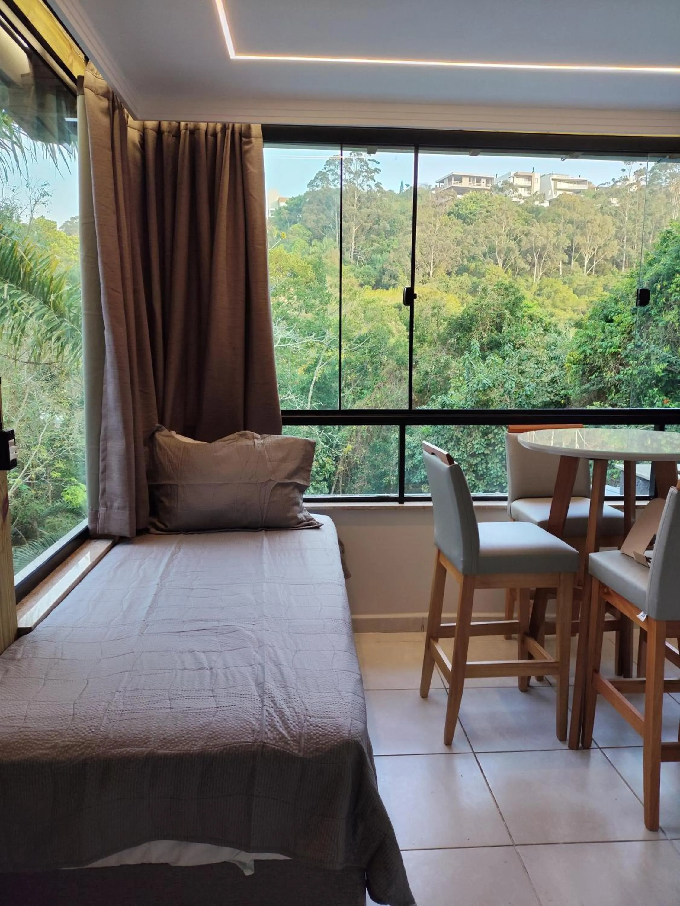 Bed in Bombinhas Guest House