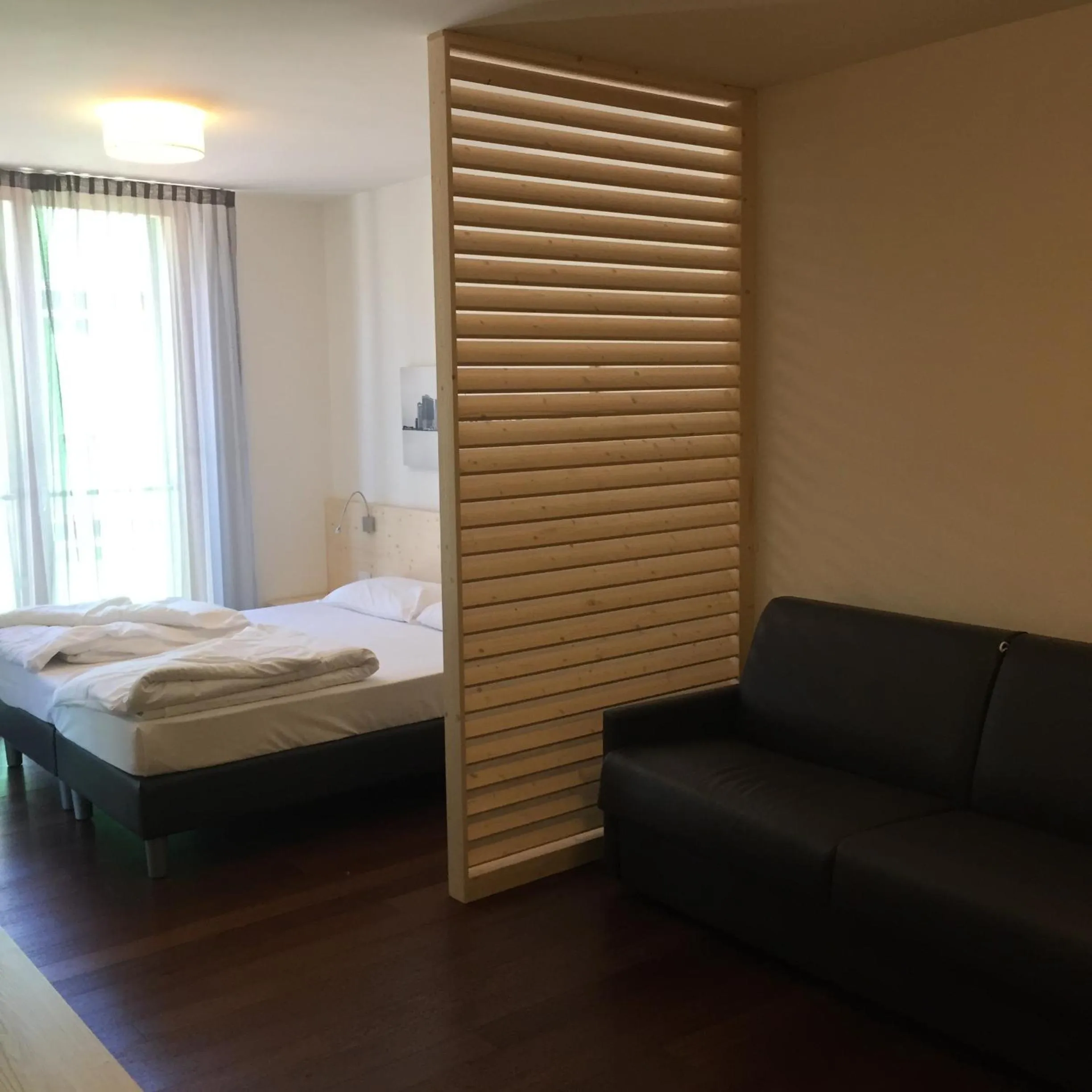 Day, Bed in Komodo short stay apartments