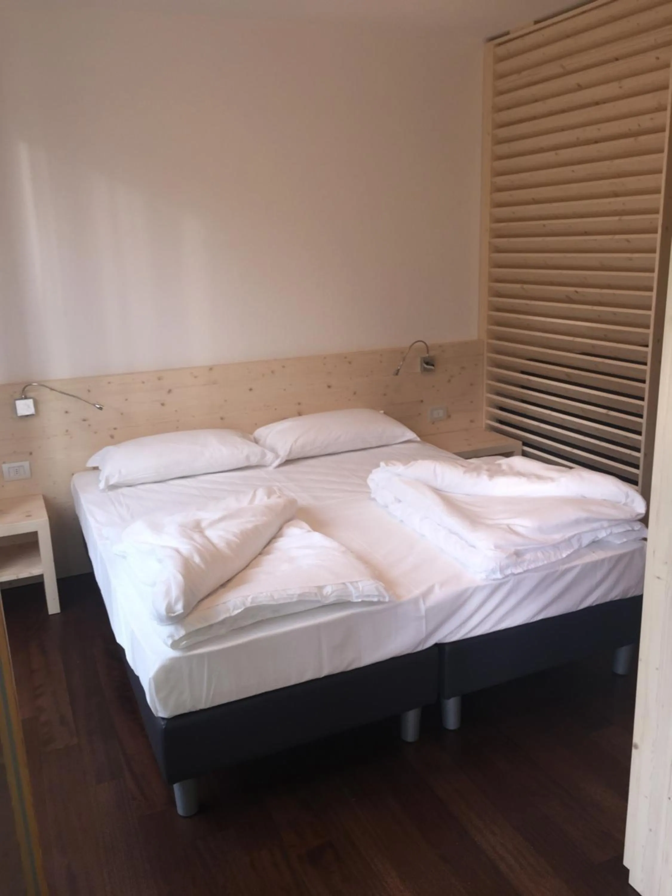 Bed in Komodo short stay apartments