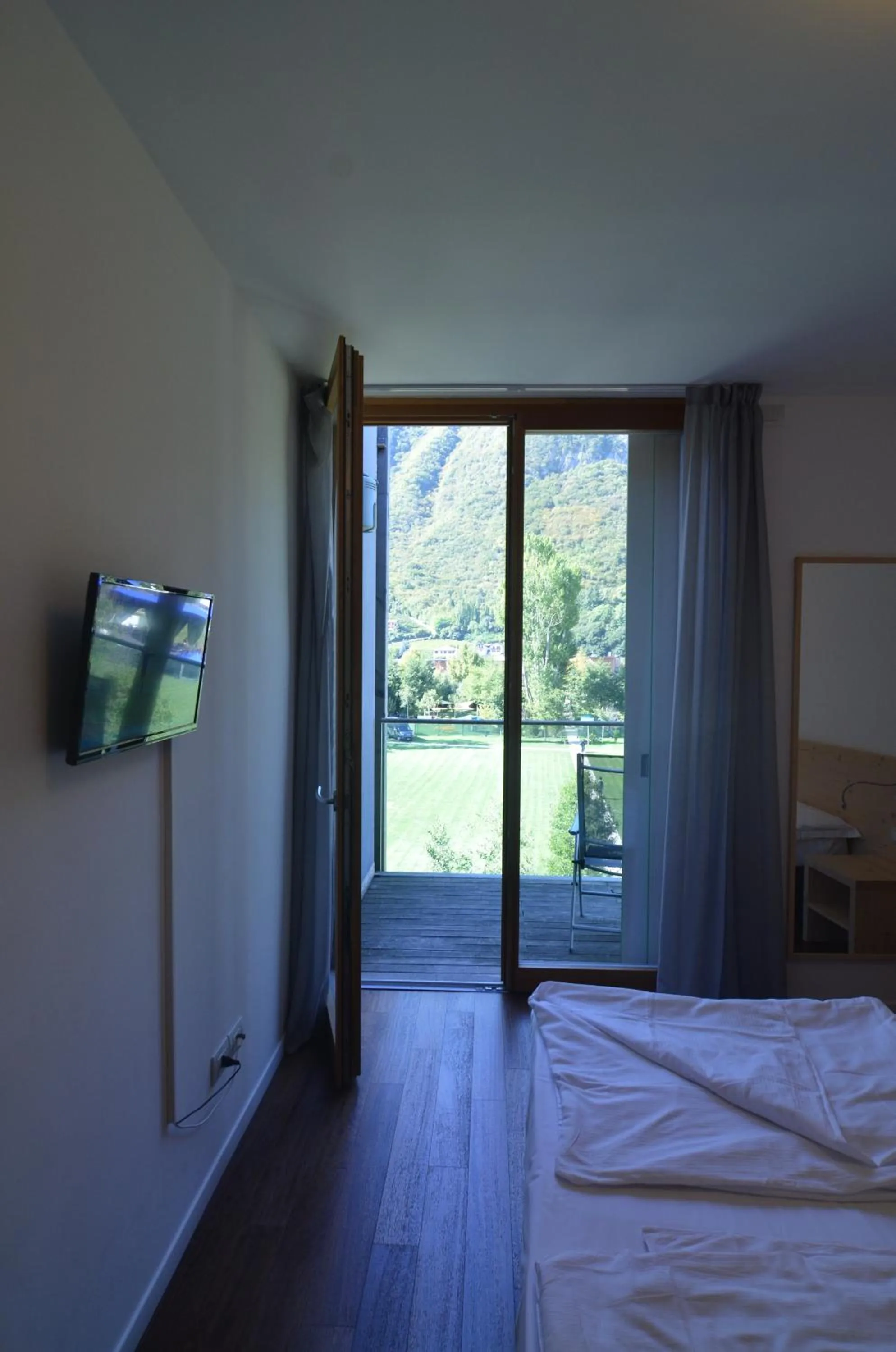 TV and multimedia, Bed in Komodo short stay apartments