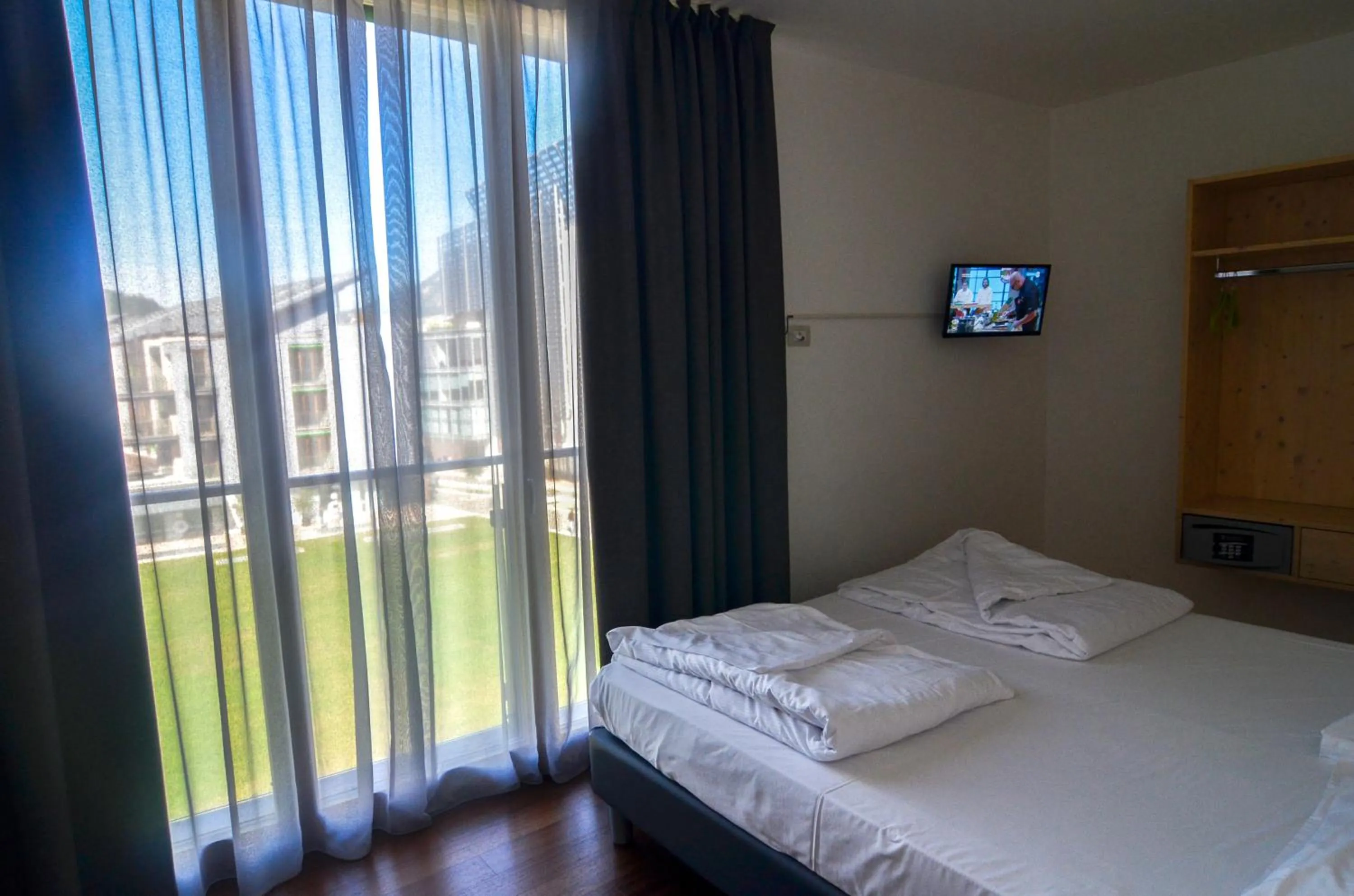 Bed in Komodo short stay apartments