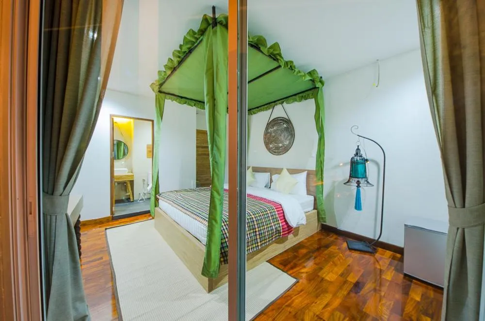 Bed in Nakorn De Sukhothai Hip Hotel