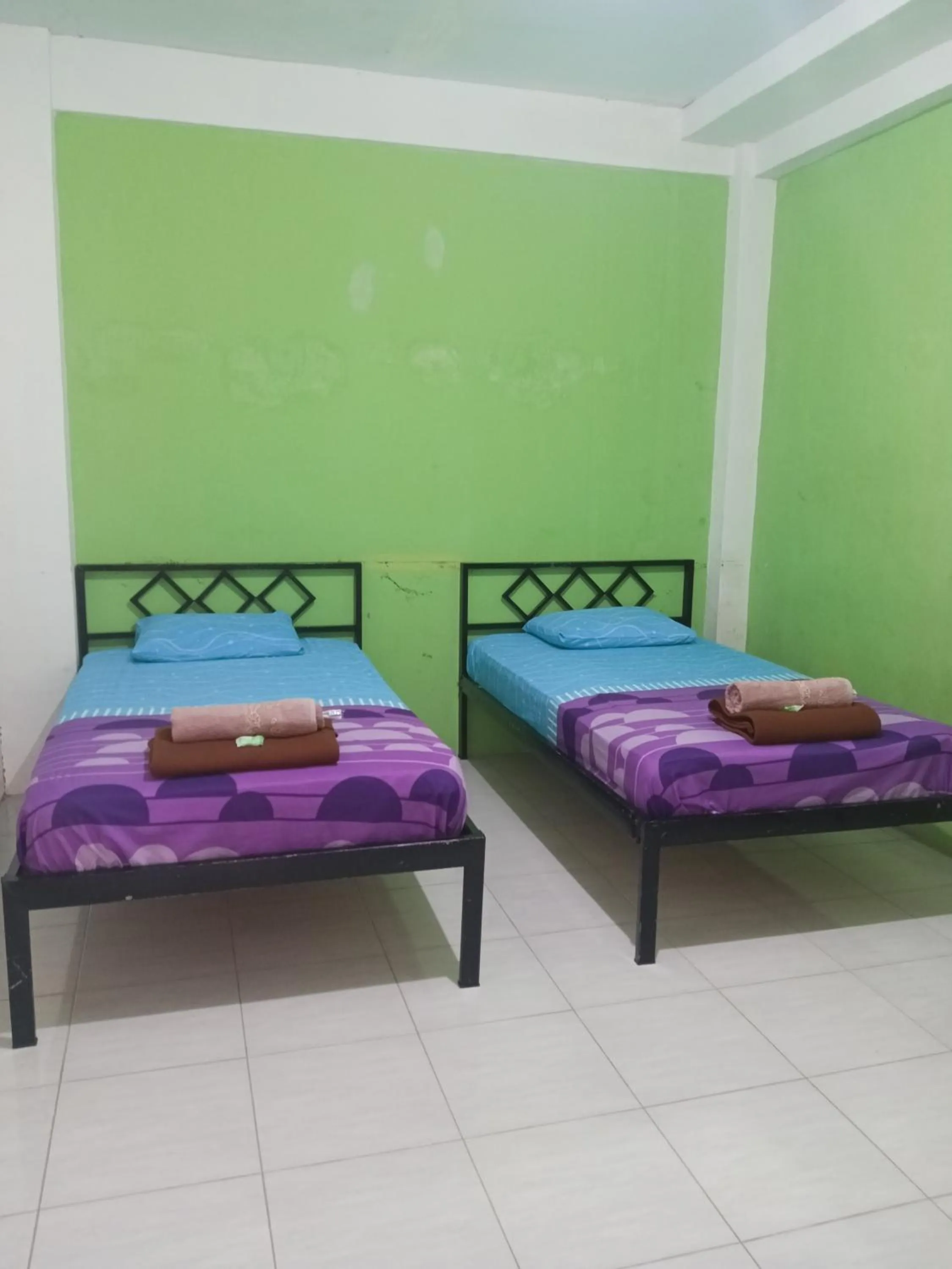 Bed in BOTANIA HOMESTAY BATAM