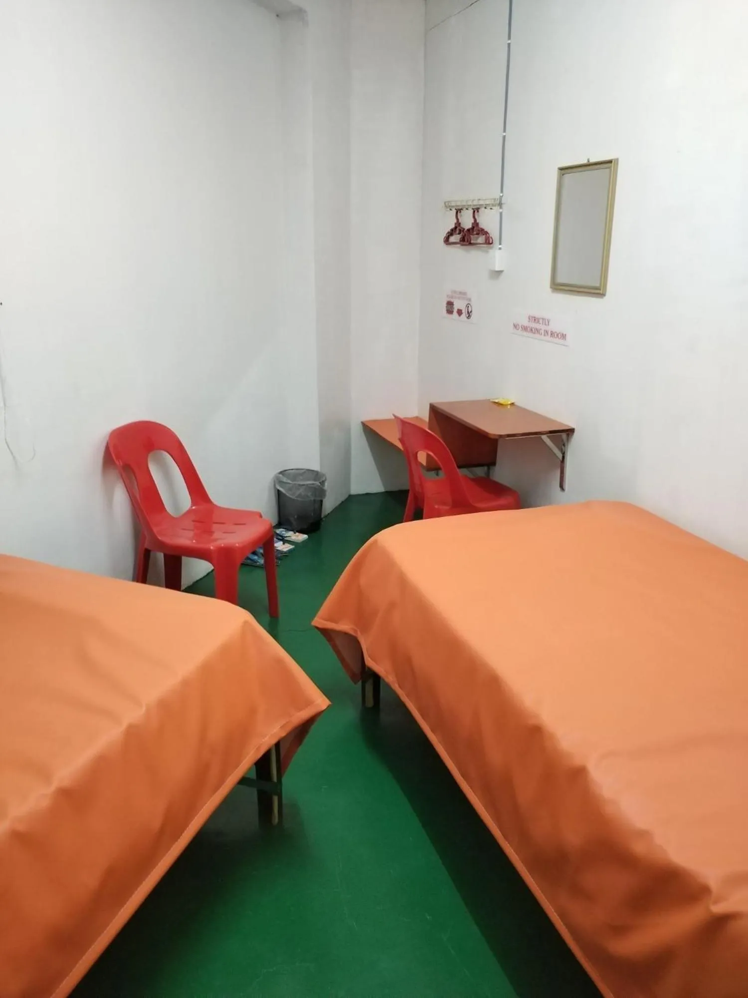 Photo of the whole room, Bed in WISMA ORCHID HOMESTAY Tuaran