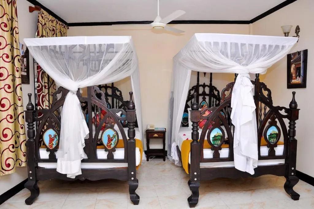 Bed in Forodhani Park Hotel