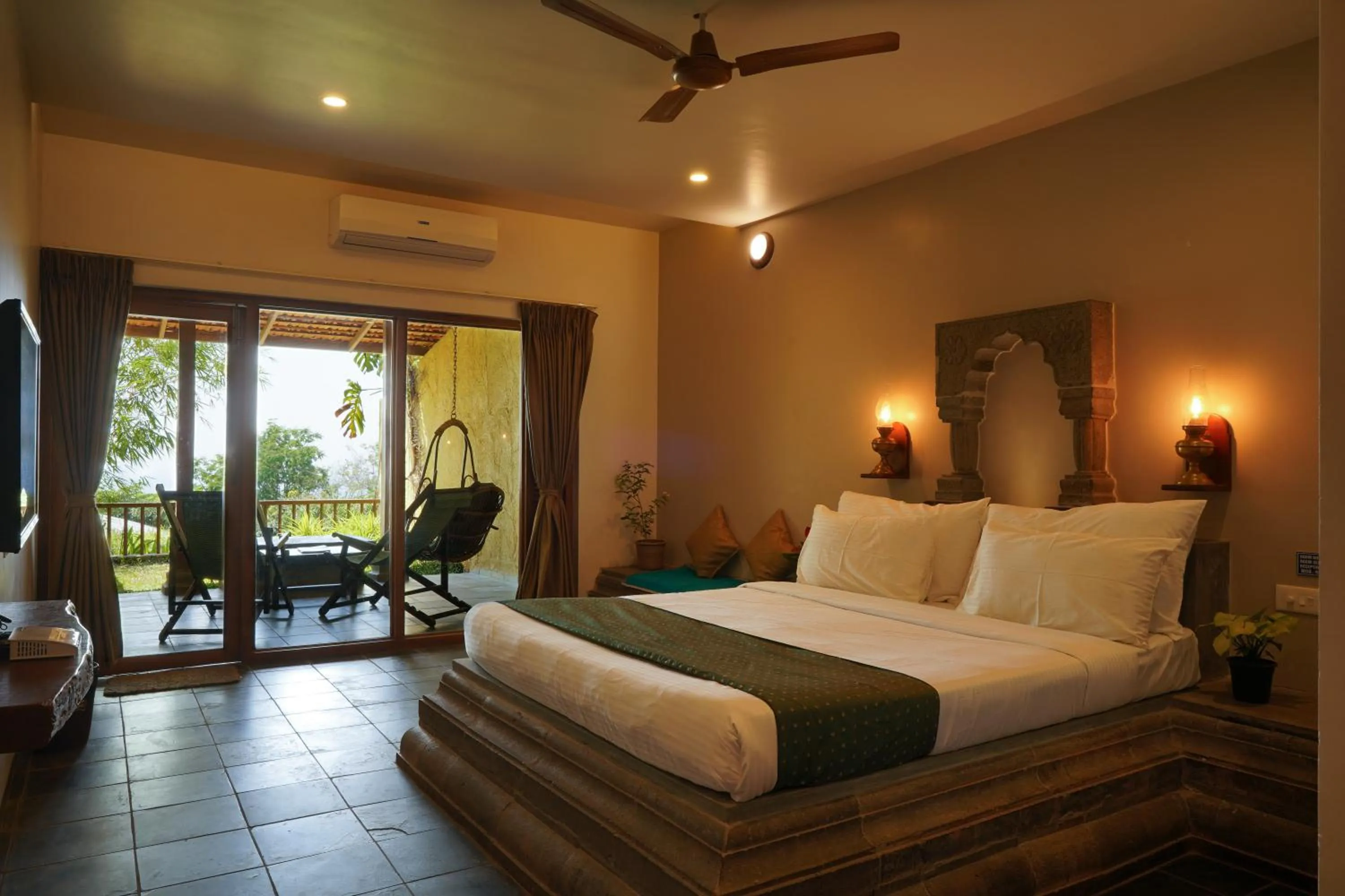 Bed in Nisarg Resort