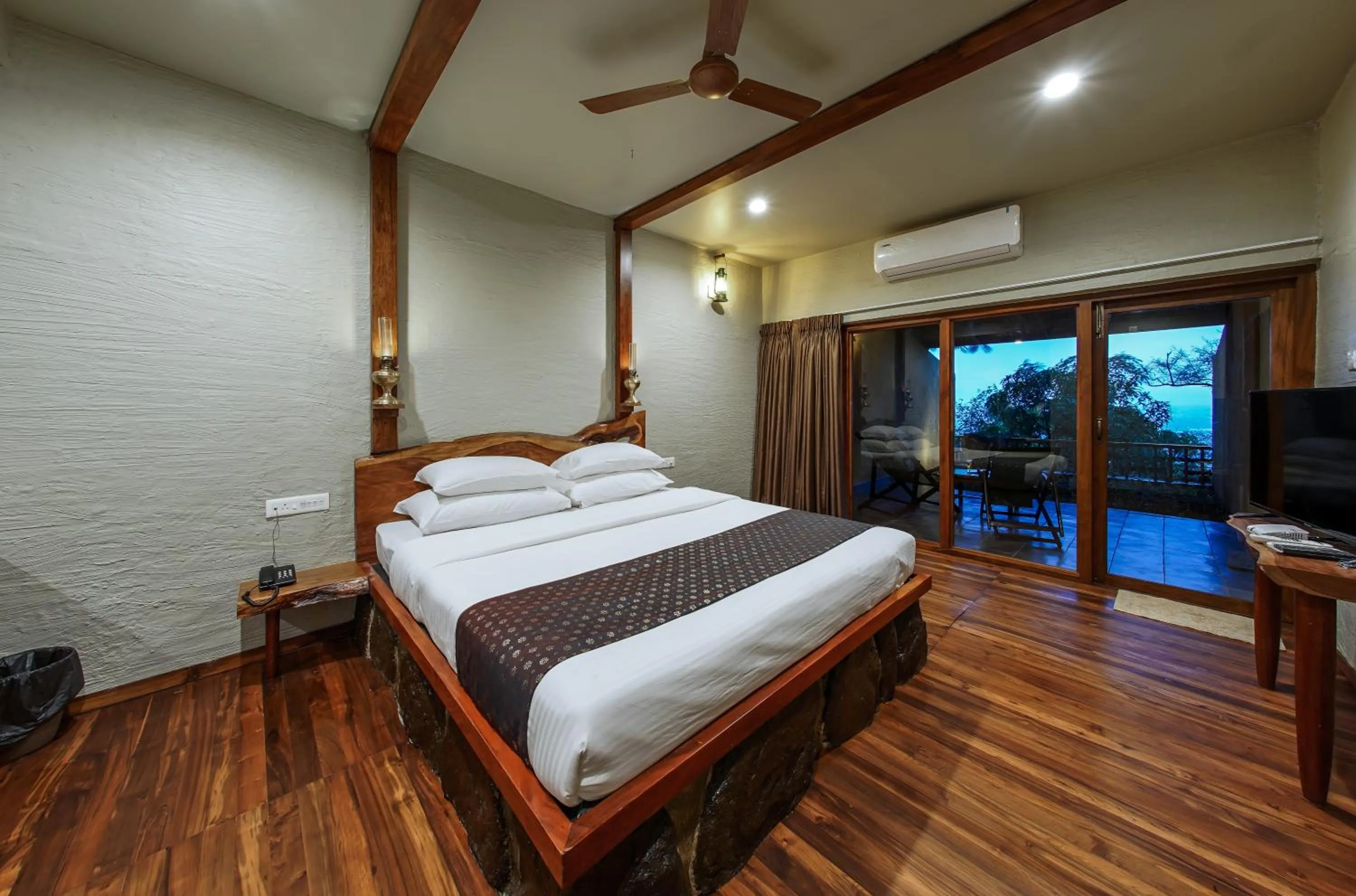 Bed in Nisarg Resort