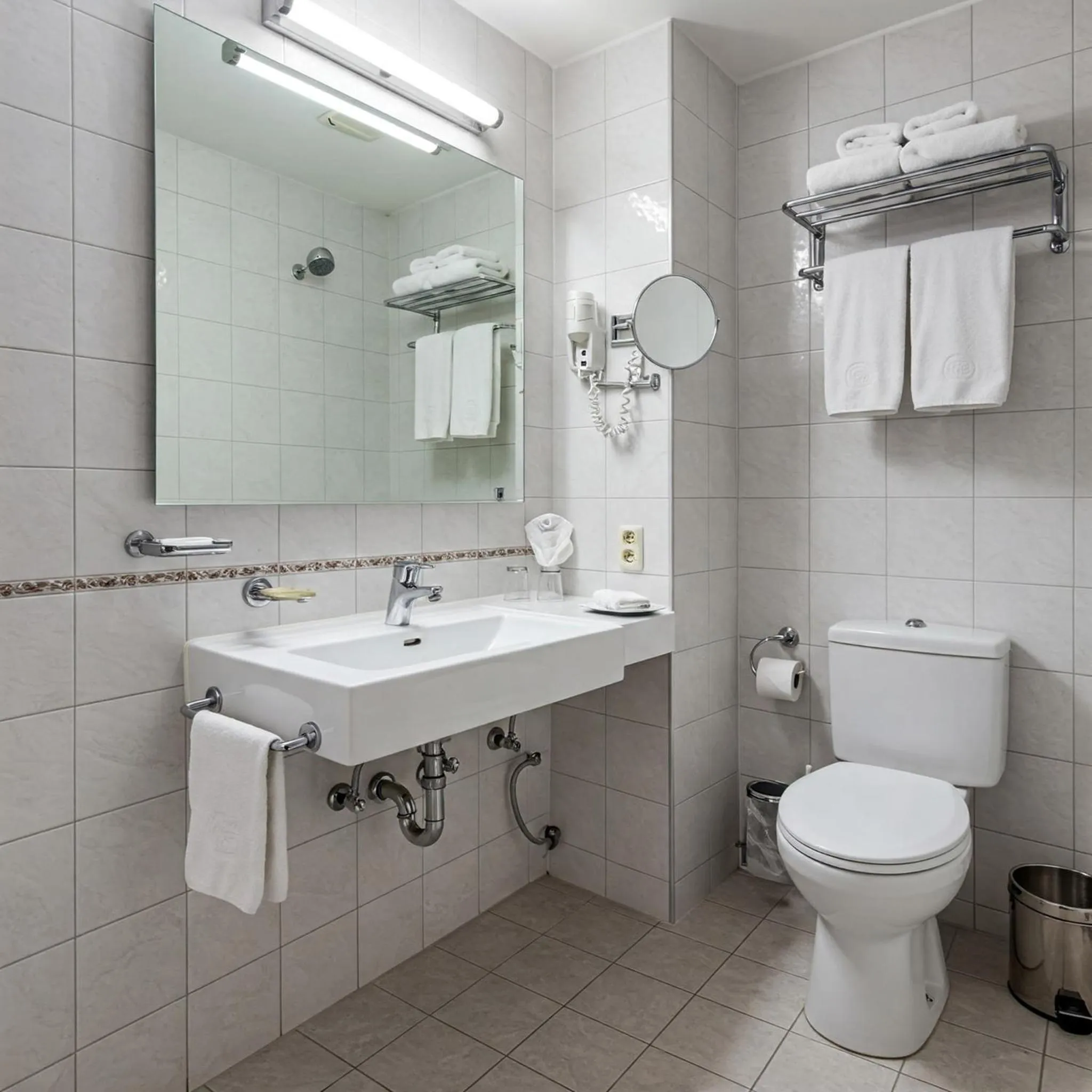 Bathroom in Premier Suites Business Hotel