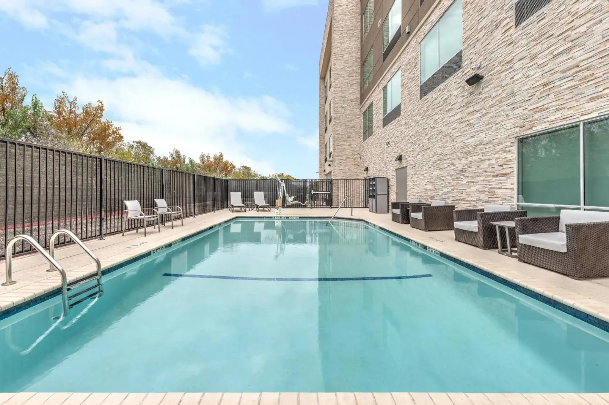 Swimming pool in Holiday Inn Express & Suites Austin Airport East by IHG Swimming pool in Holiday Inn Express & Suites Austin Airport East by IHG