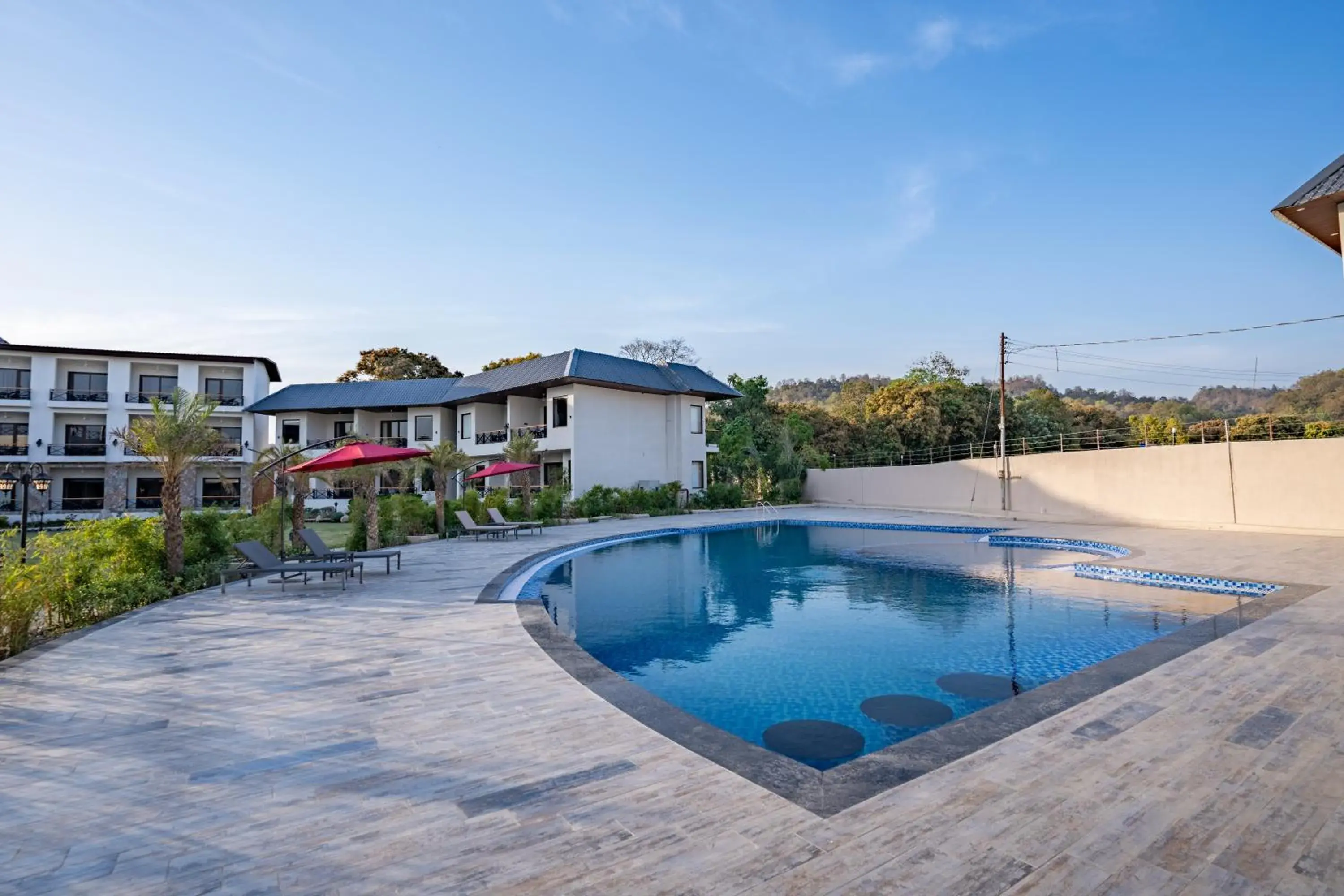 Swimming pool in Shervani Pebbles & Pines Resort & Spa, Corbett Swimming pool in Shervani Pebbles & Pines Resort & Spa, Corbett
