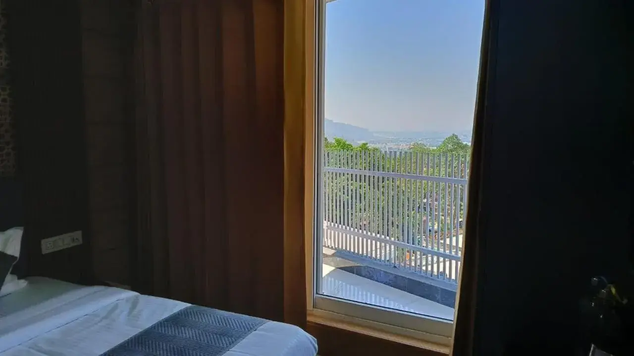 View (from property/room), Bed in Hotel Asha Delight View (from property/room), Bed in Hotel Asha Delight