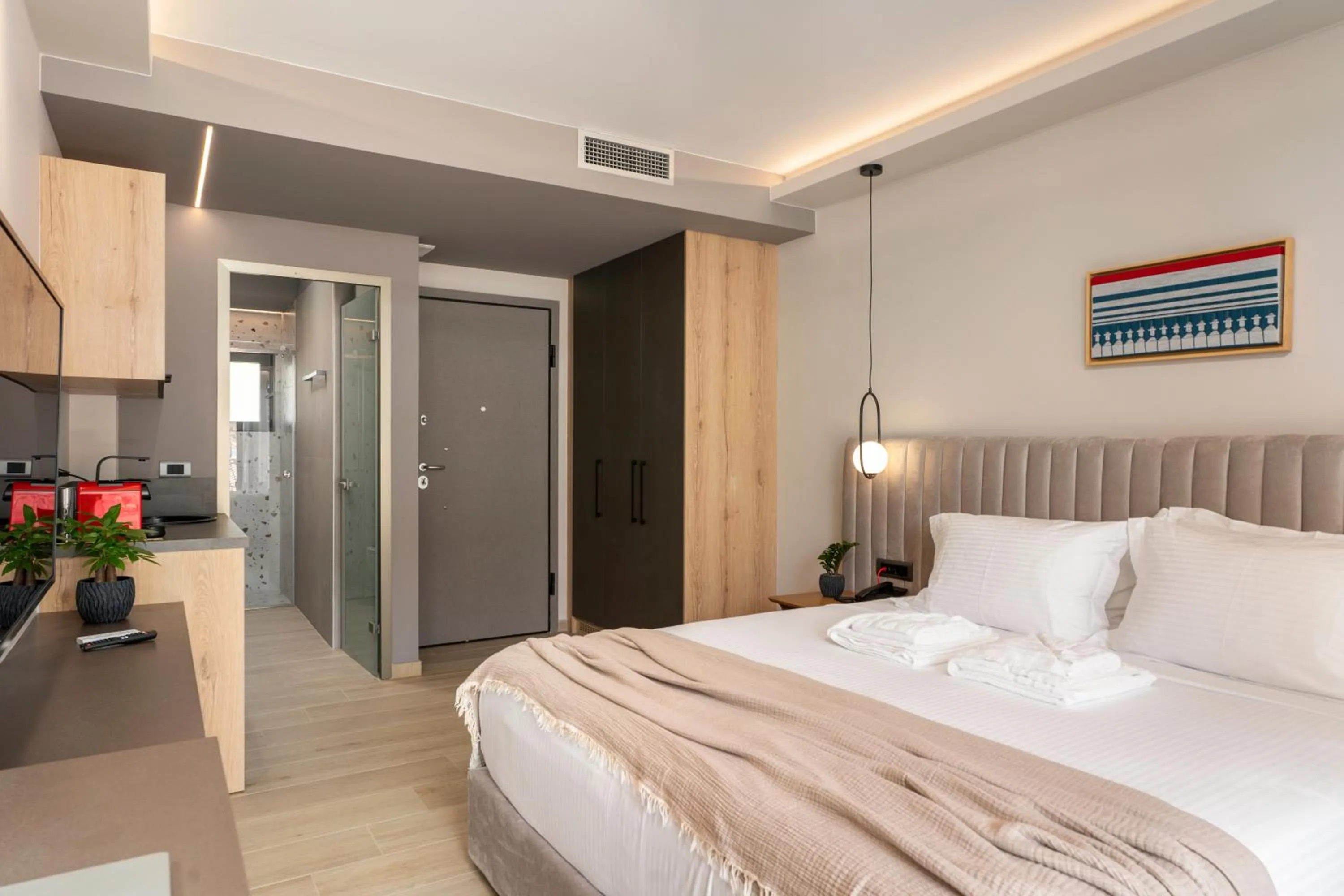 Bed in Ennea Muses Rooms and Suites