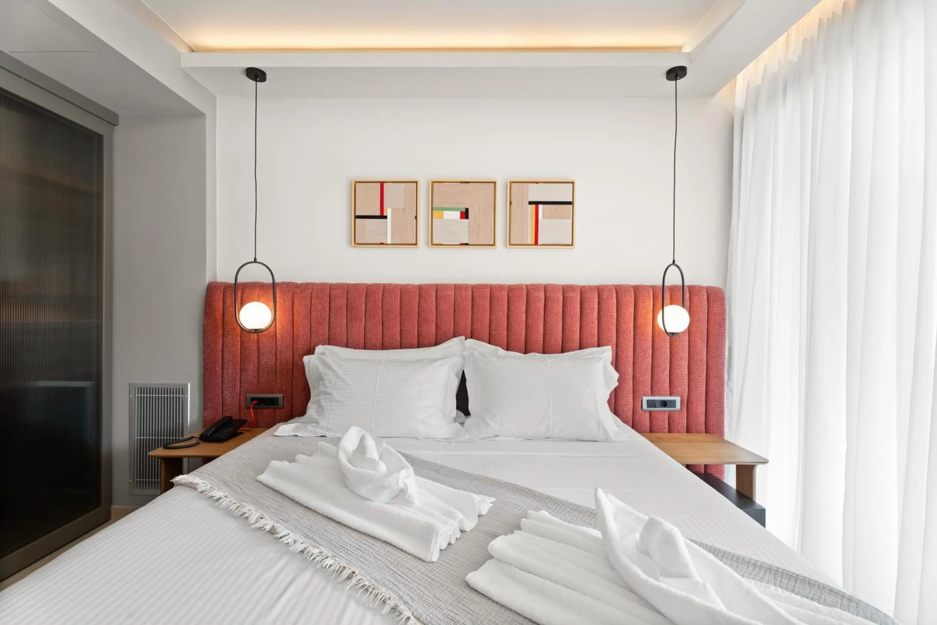 Bed in Ennea Muses Rooms and Suites