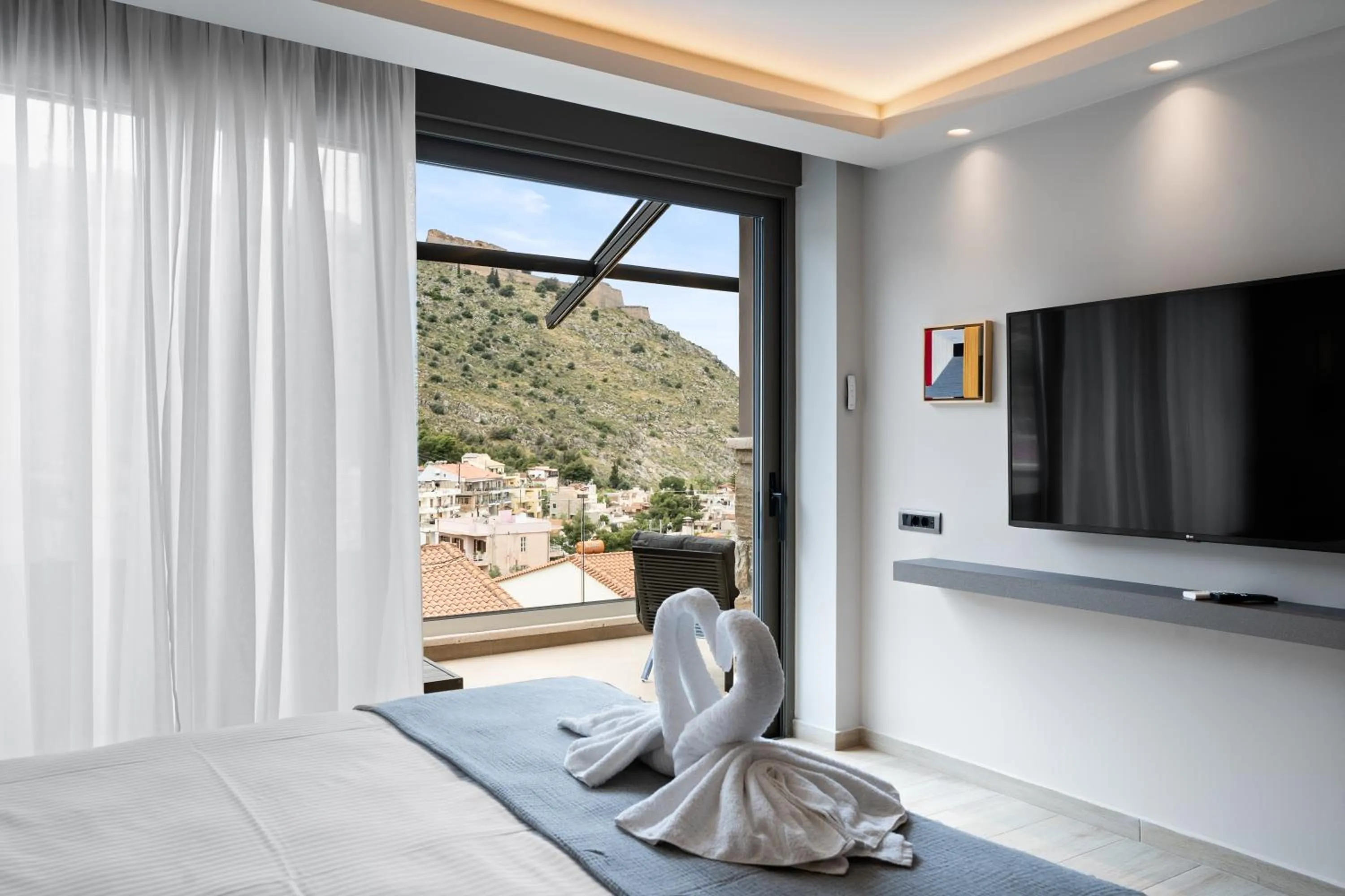 Bed in Ennea Muses Rooms and Suites